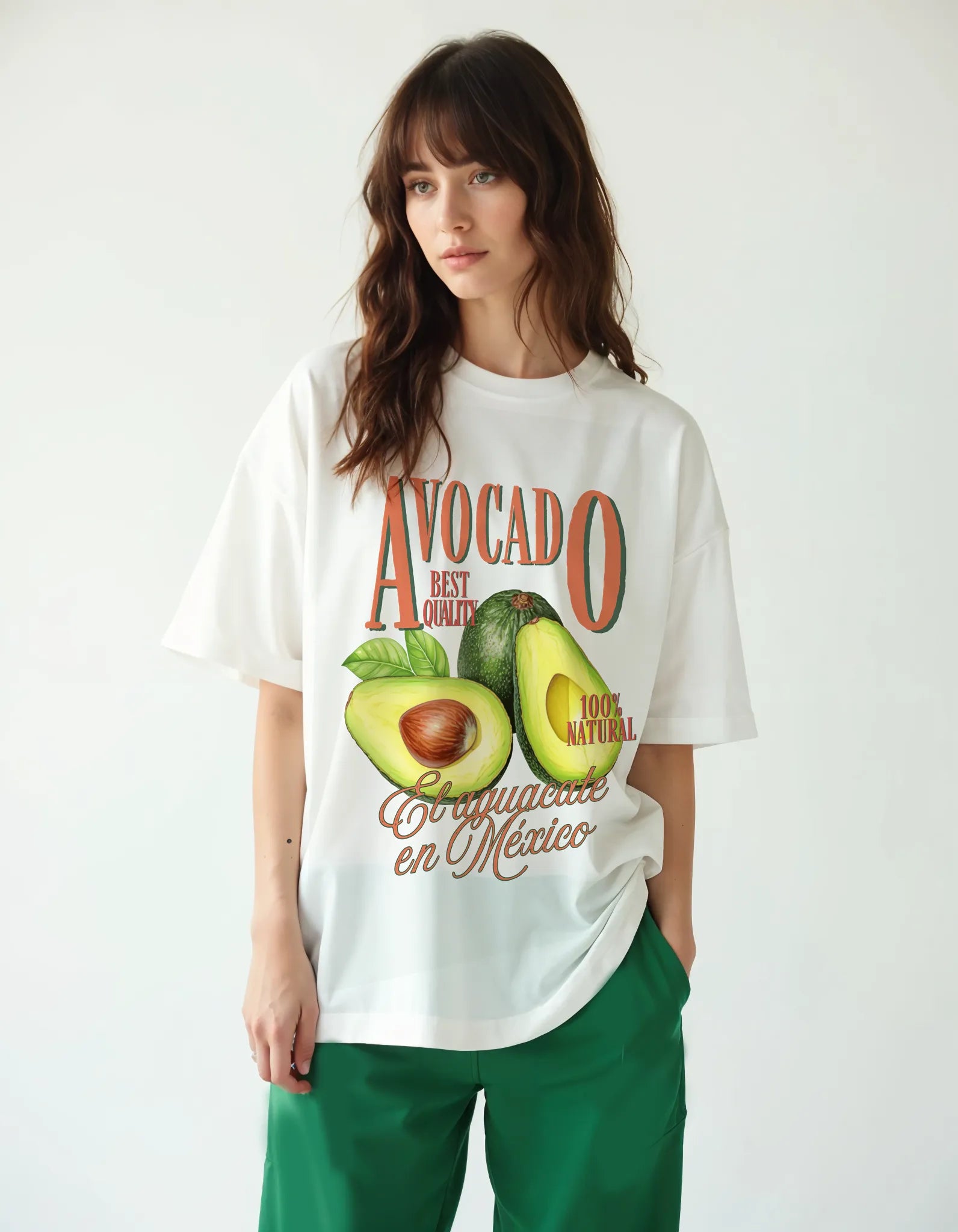 Empulse™ Sorona avocado tee in white styled casually with green track pants by female model