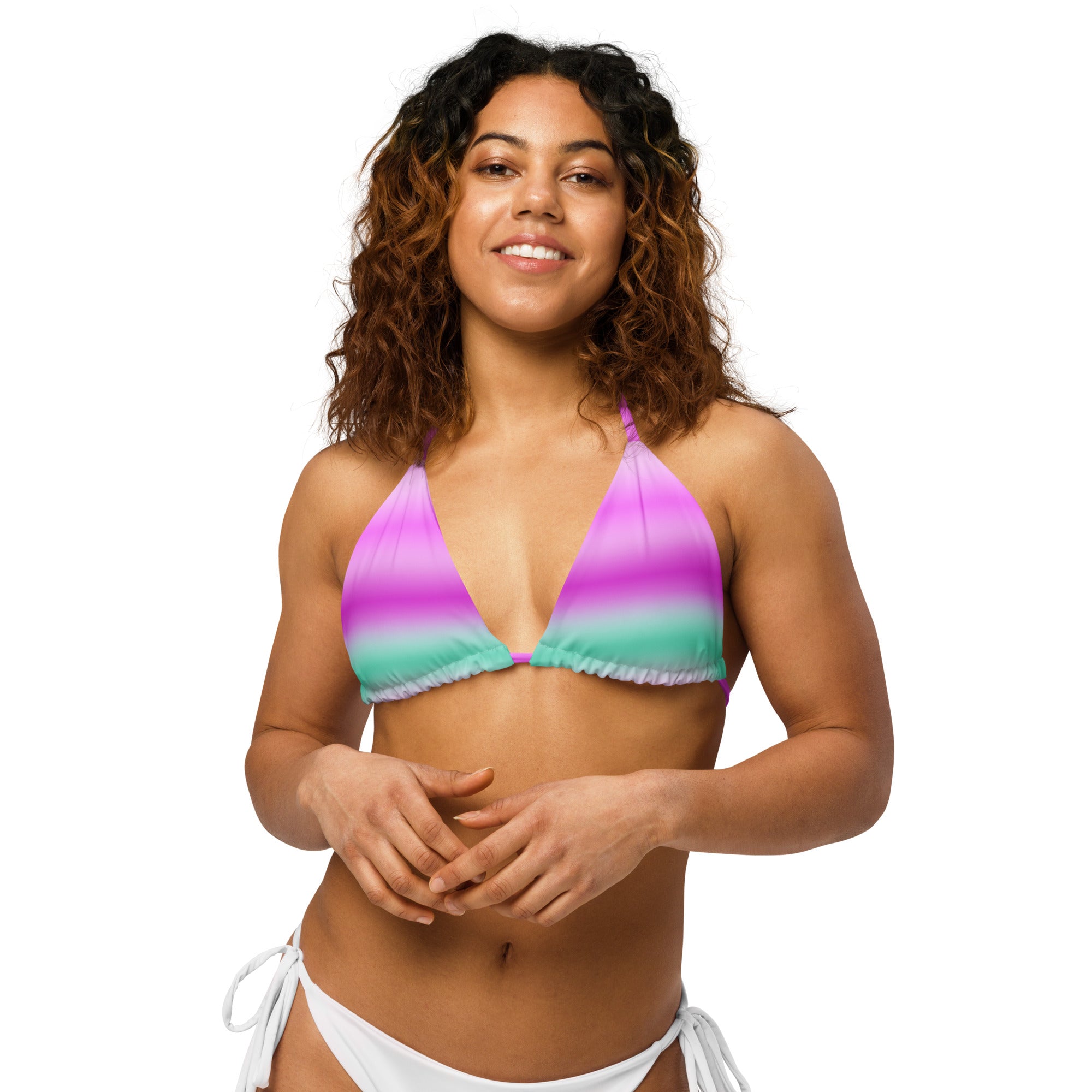 Model smiling in Empulse™ cotton candy striped bikini top