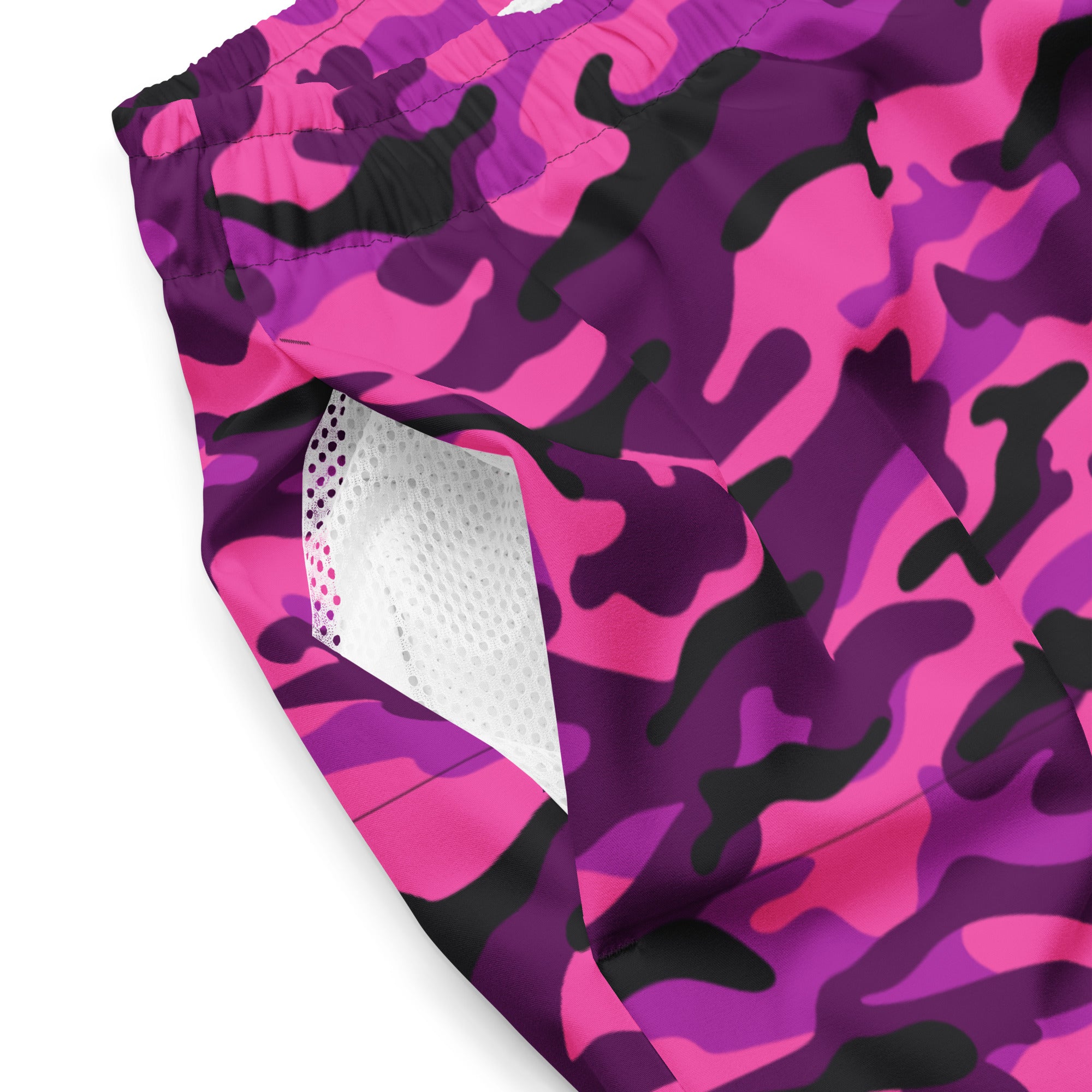 Close-up of Empulse™ Blush Camouflage fabric showing pink camo print and mesh pocket
