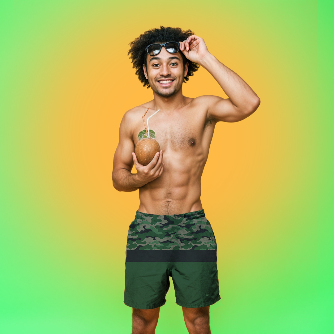 Model posing in Empulse™ Camouflage swim shorts with bright neon green backdrop
