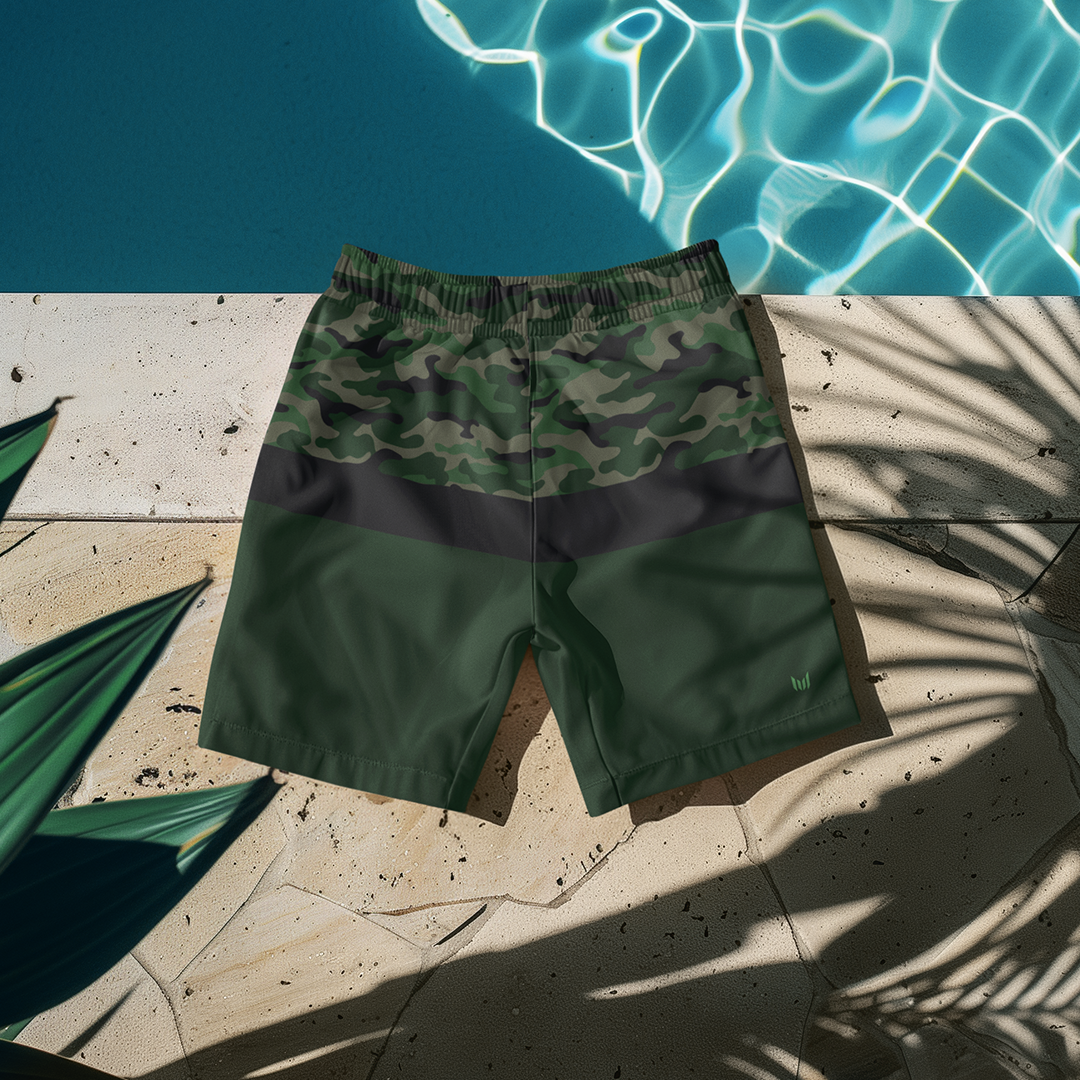 Flat lay of Empulse™ Camouflage shorts placed neatly on a striped outdoor lounge chair