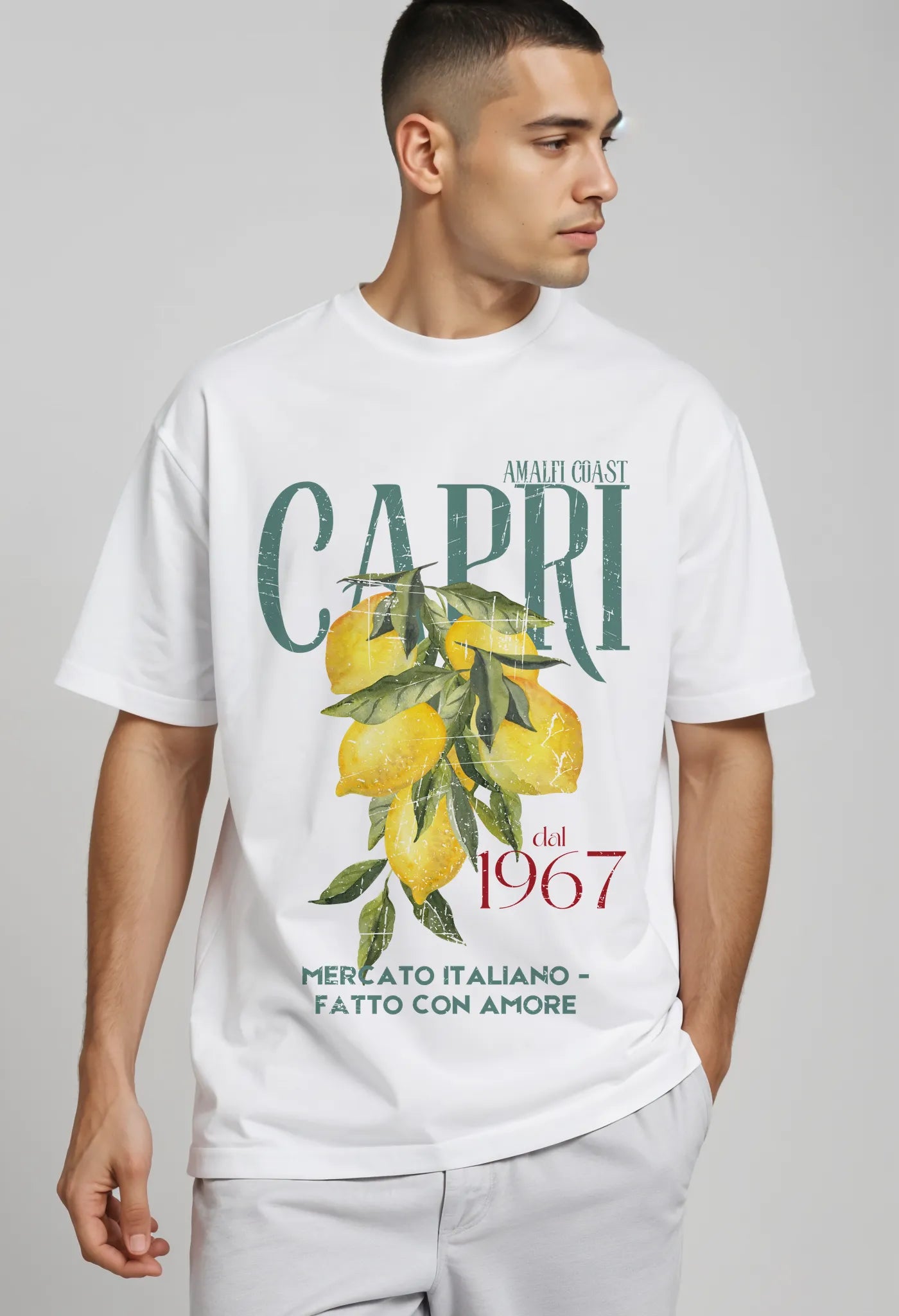 Empulse™ Capri Lemons t-shirt in white Sorona blend worn by male model with side gaze, styled with soft summer energy