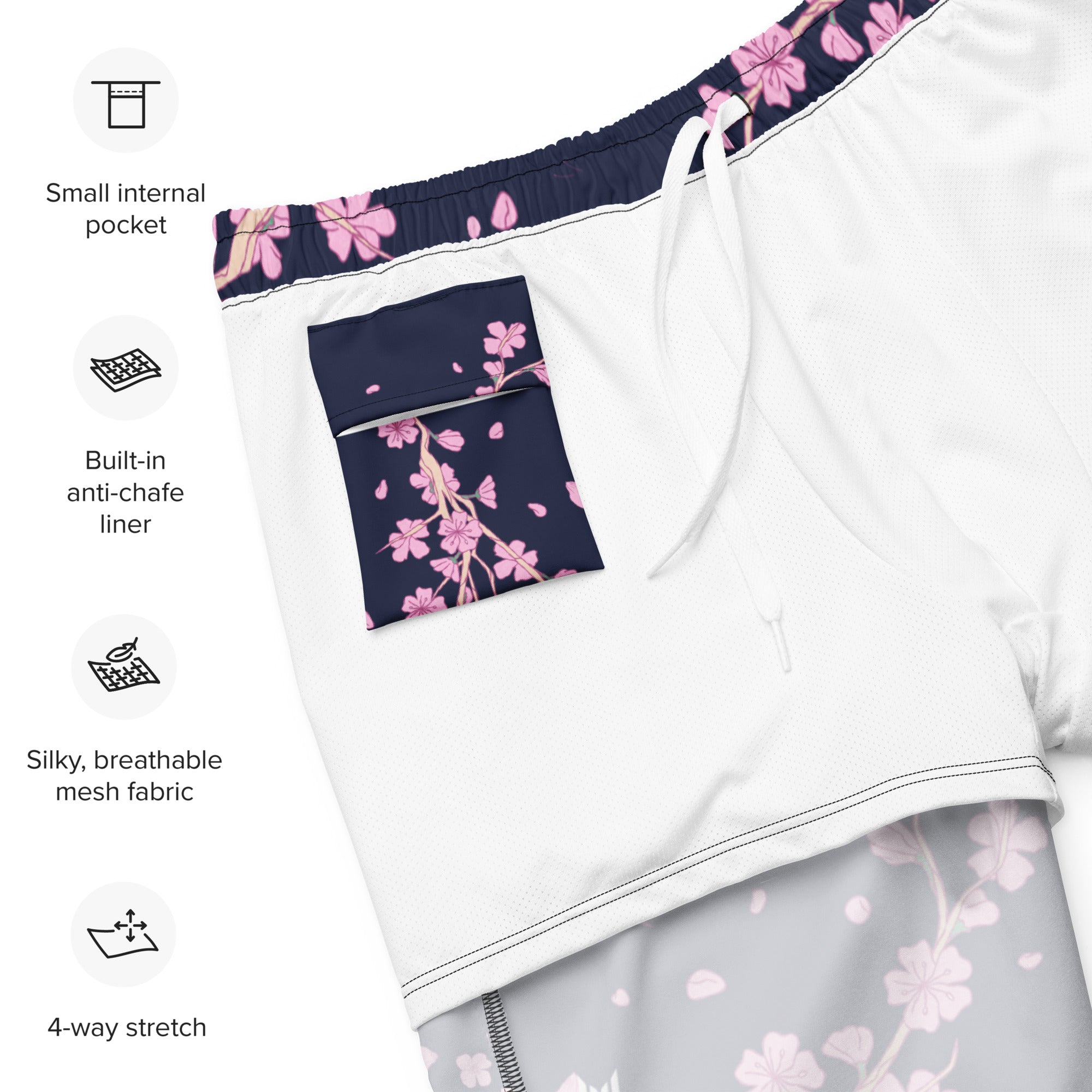 Flat lay of Empulse™ Cherry Blossom swim shorts showing interior label and waistband tag