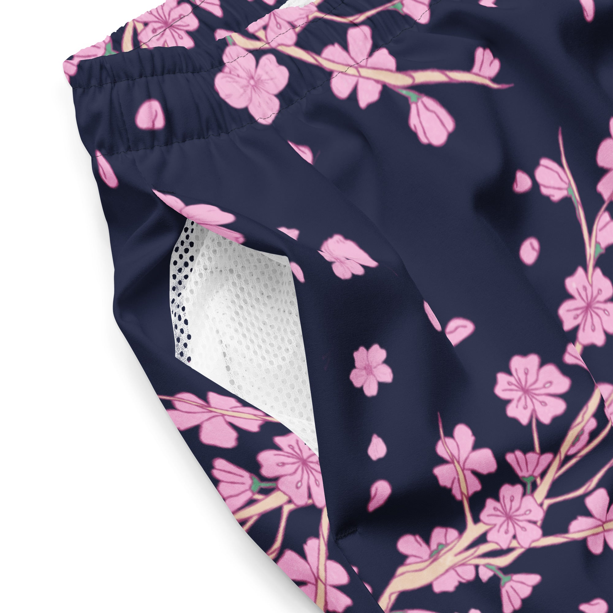 Close-up of Empulse™ Cherry Blossom fabric with pink blossoms and white mesh pocket detail