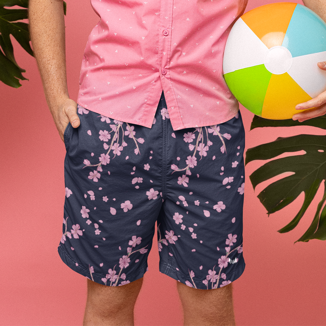 Empulse™ Cherry Blossom shorts styled with a pink shirt in tropical studio scene