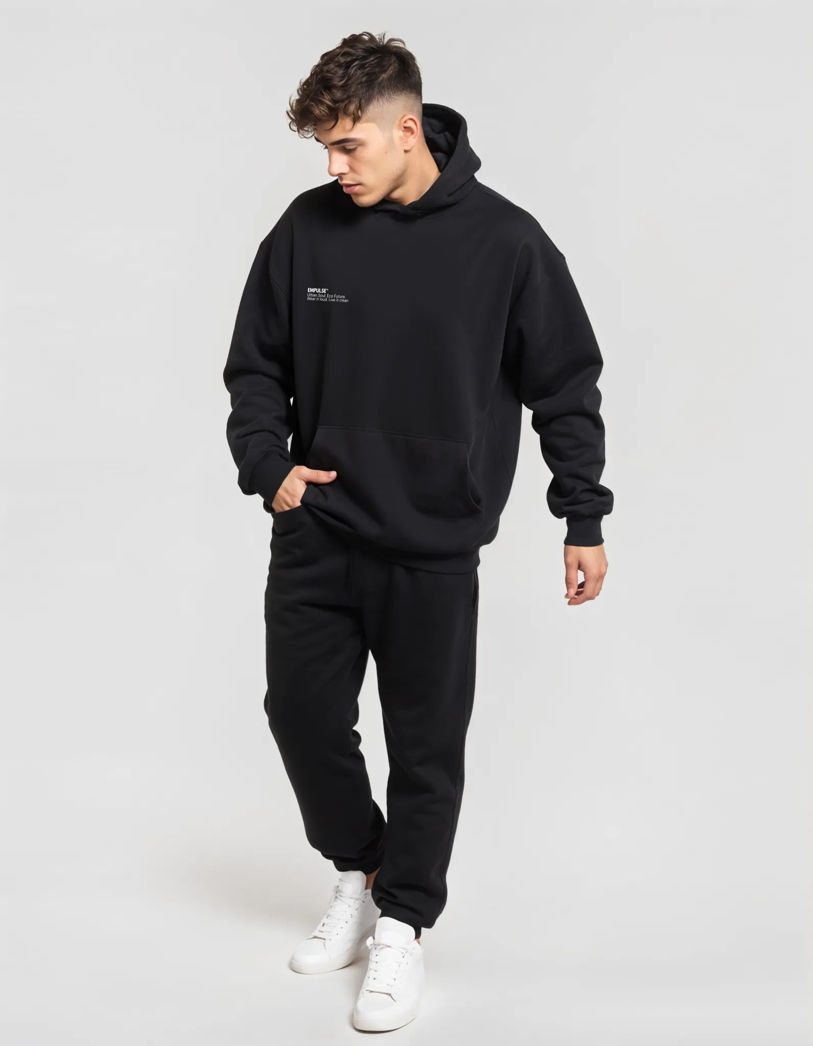 Black Empulse DNA Oversized Hoodie worn by walking male model

