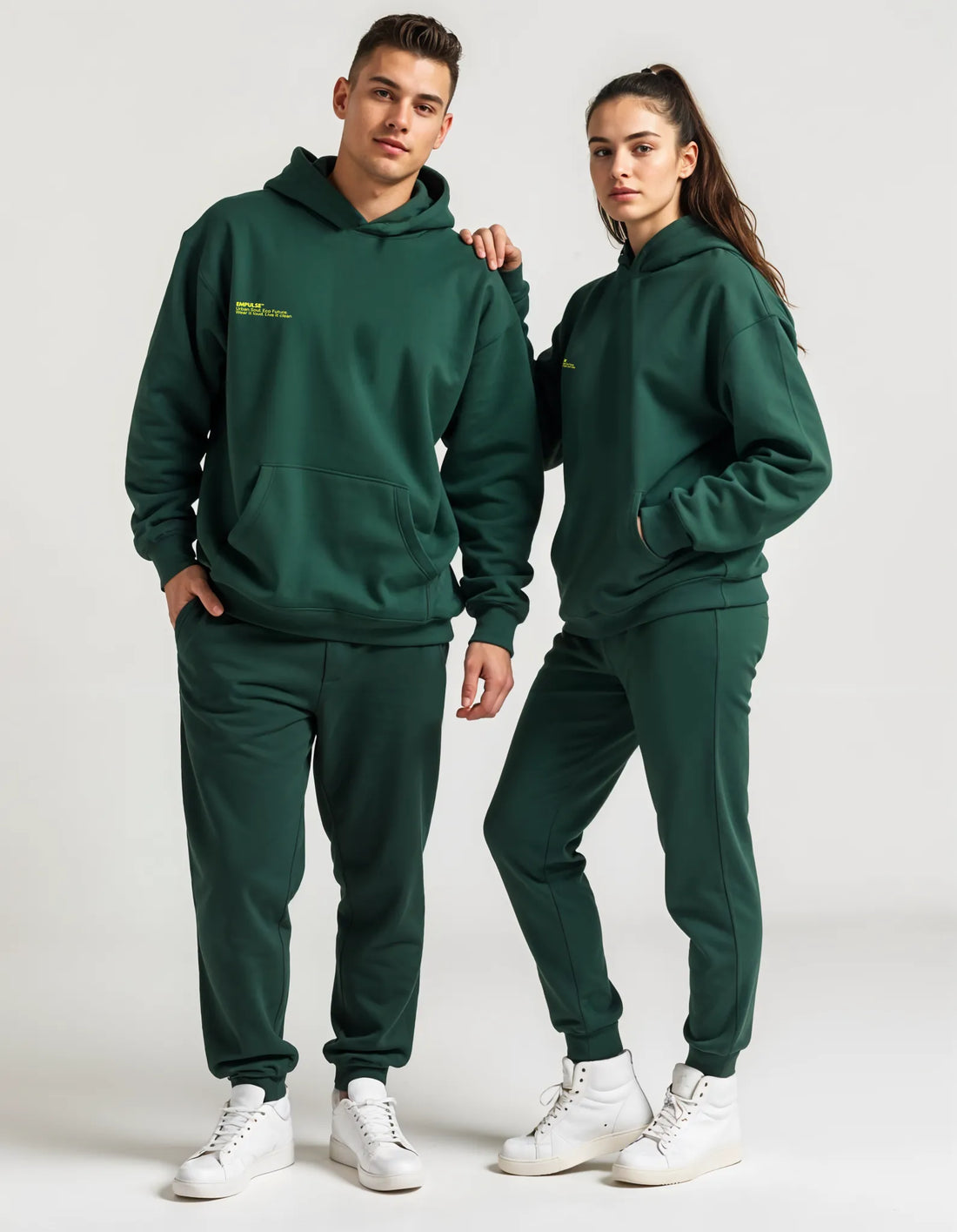 Back view of male model wearing Empulse DNA Oversized Hoodie in forest green
