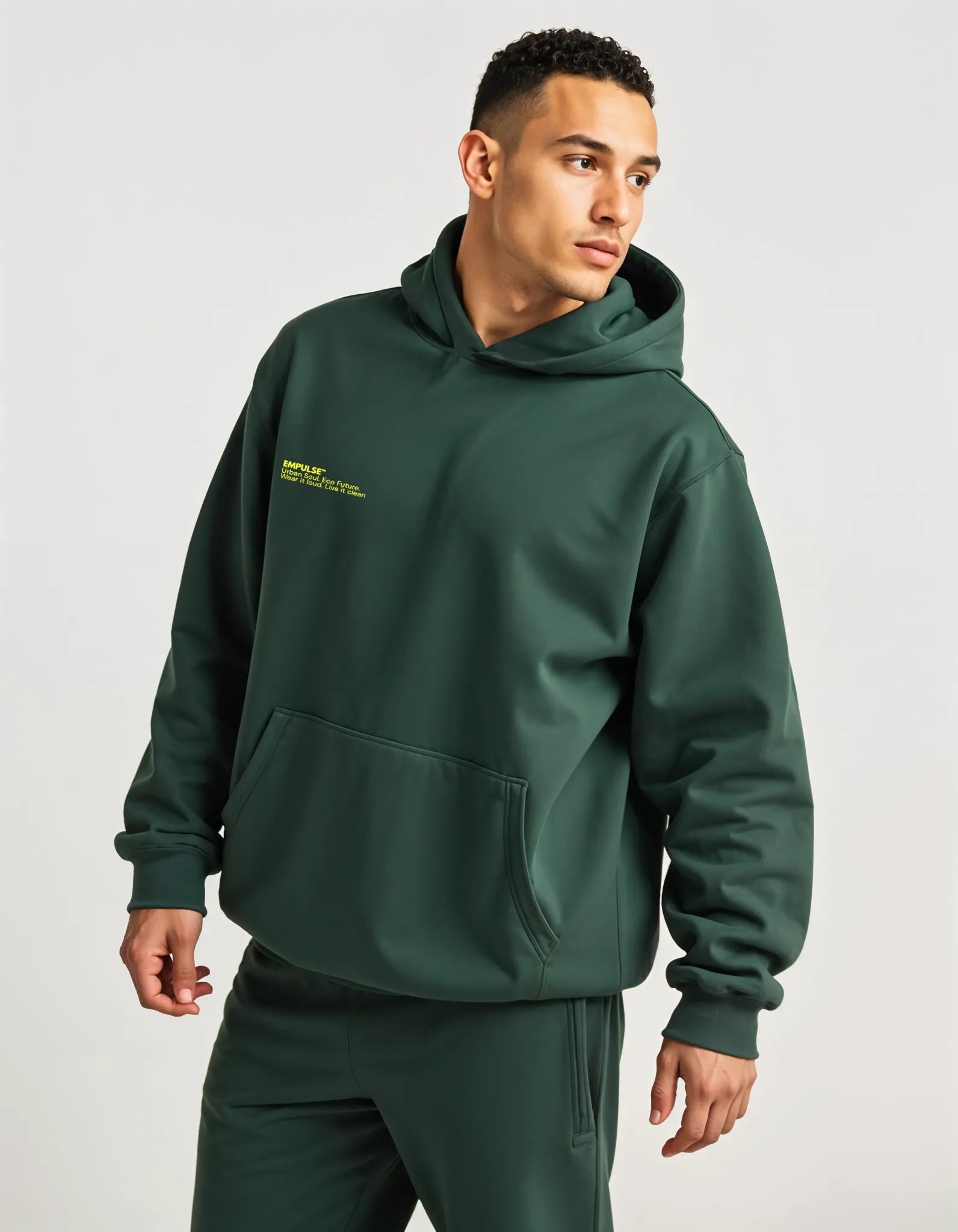 Empulse DNA Oversized Hoodie in forest green worn by male model front view