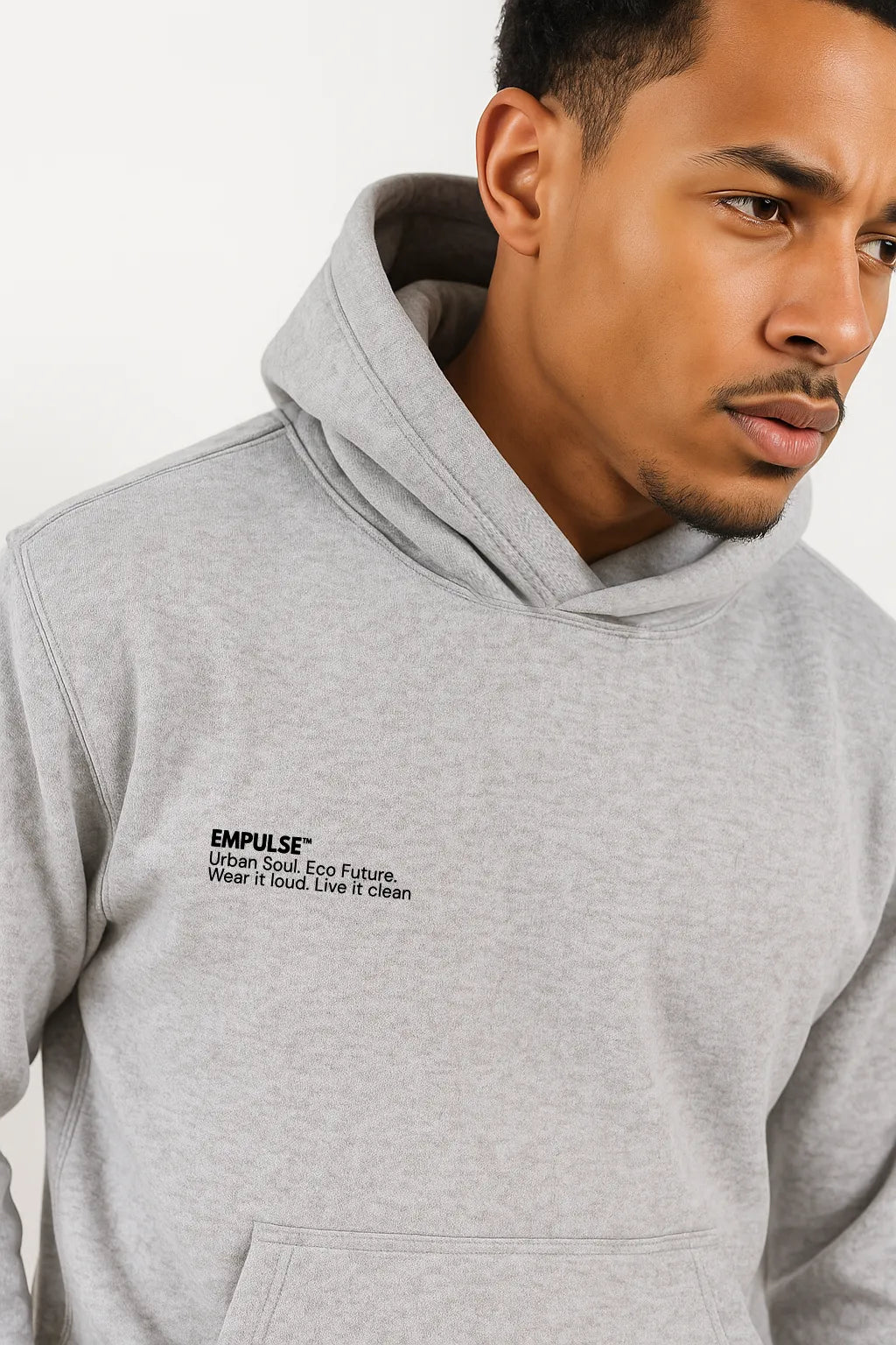Side profile of male model in grey Empulse DNA Oversized Hoodie