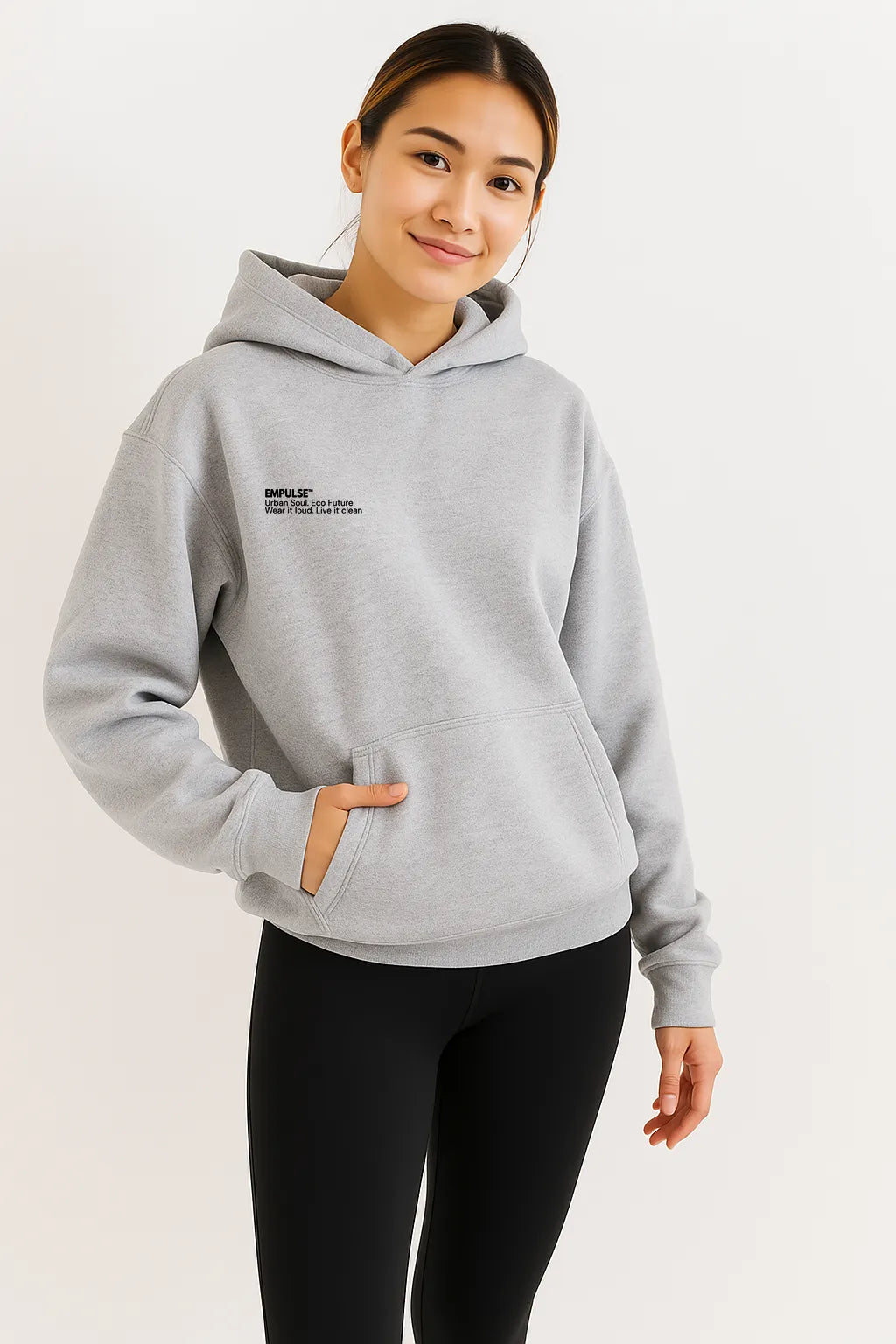 Female model wearing grey Empulse DNA Oversized Hoodie front view