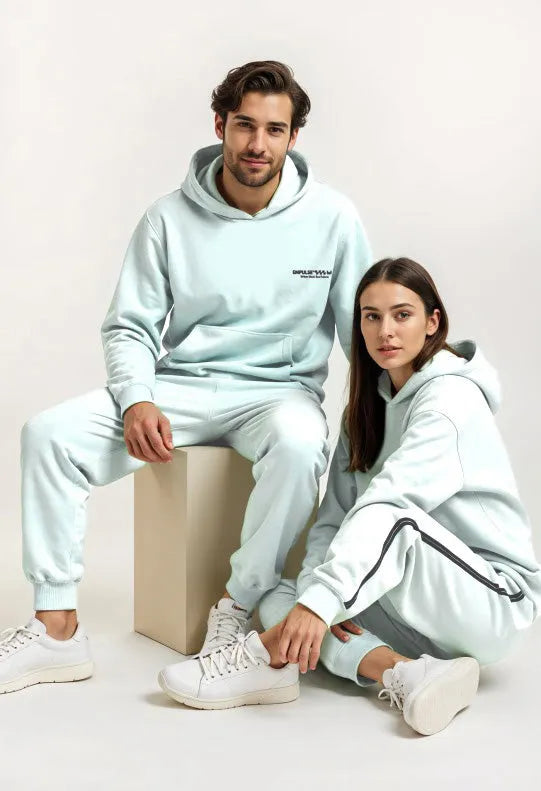 Empulse DNA Hoodie in Mint Green worn by seated male and female models