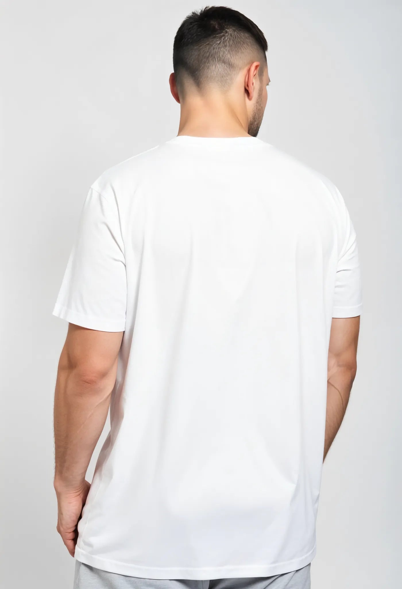 Back view of Empulse™ Gelato Sorona tee in plain white showing rear fit and drop shoulder cut