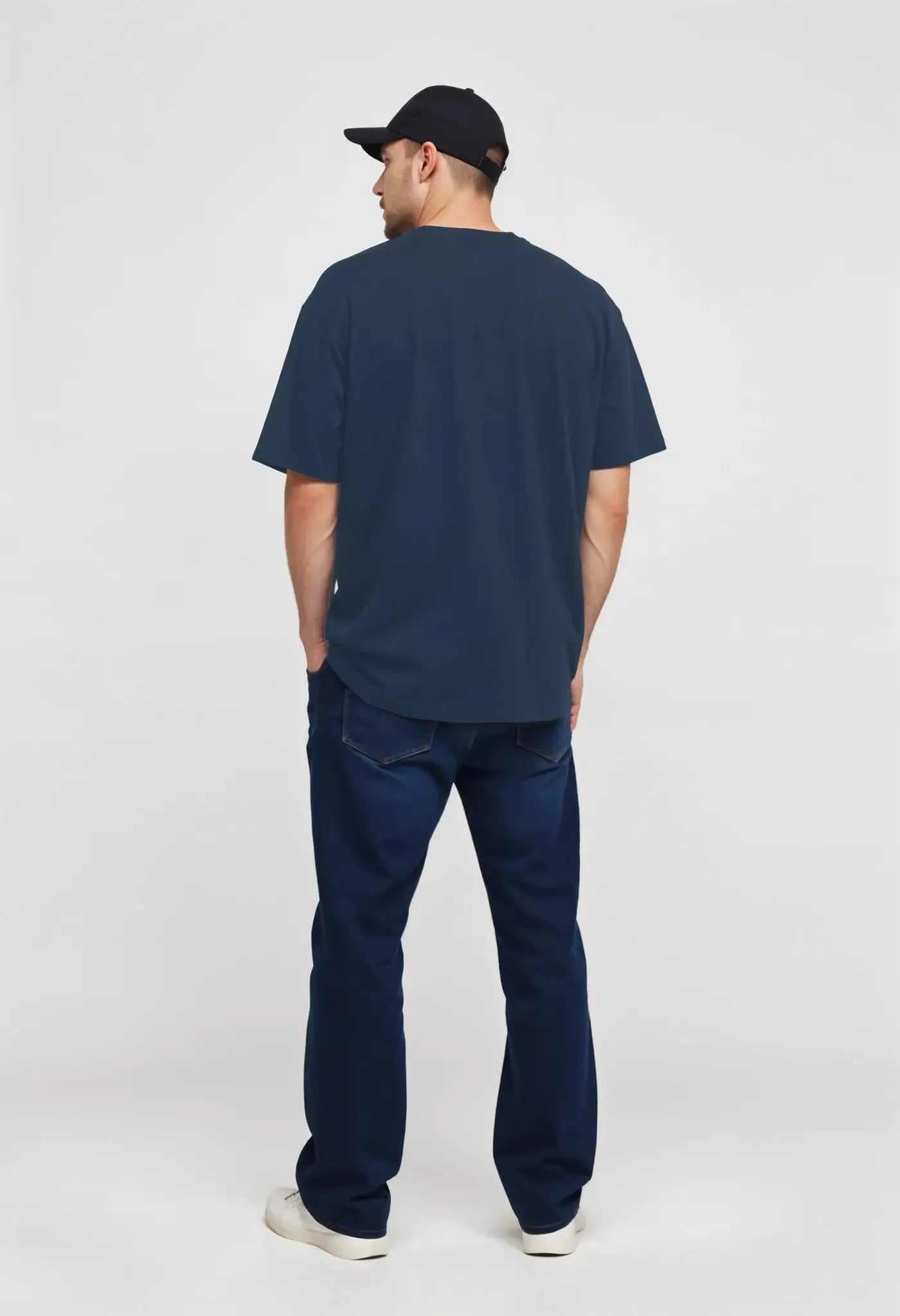 Empulse™ navy banana print t-shirt made from Sorona, back view worn by young male model