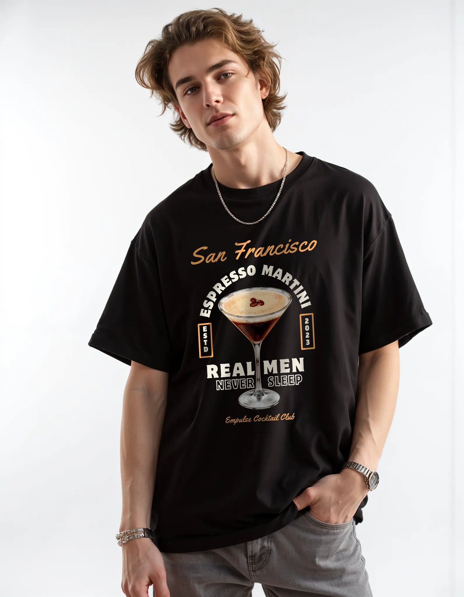 Empulse™ Irish Coffee t-shirt in black Sorona blend worn by male model, styled with chain and neutral pants