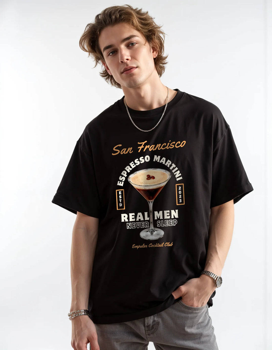 Empulse™ Irish Coffee t-shirt in black Sorona blend worn by male model, styled with chain and neutral pants