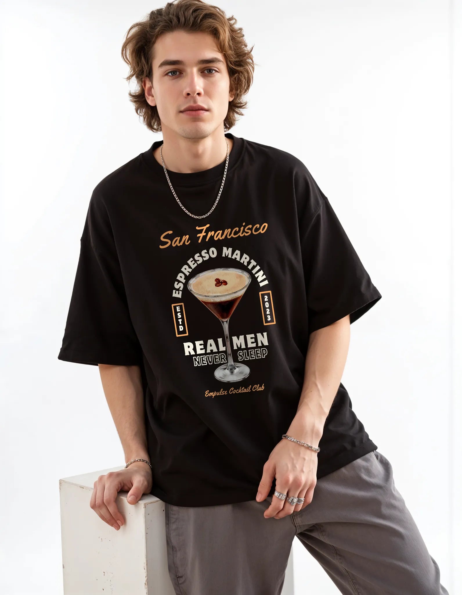 Empulse™ black Sorona tee with vintage Irish Coffee design, casually styled by male model in studio
