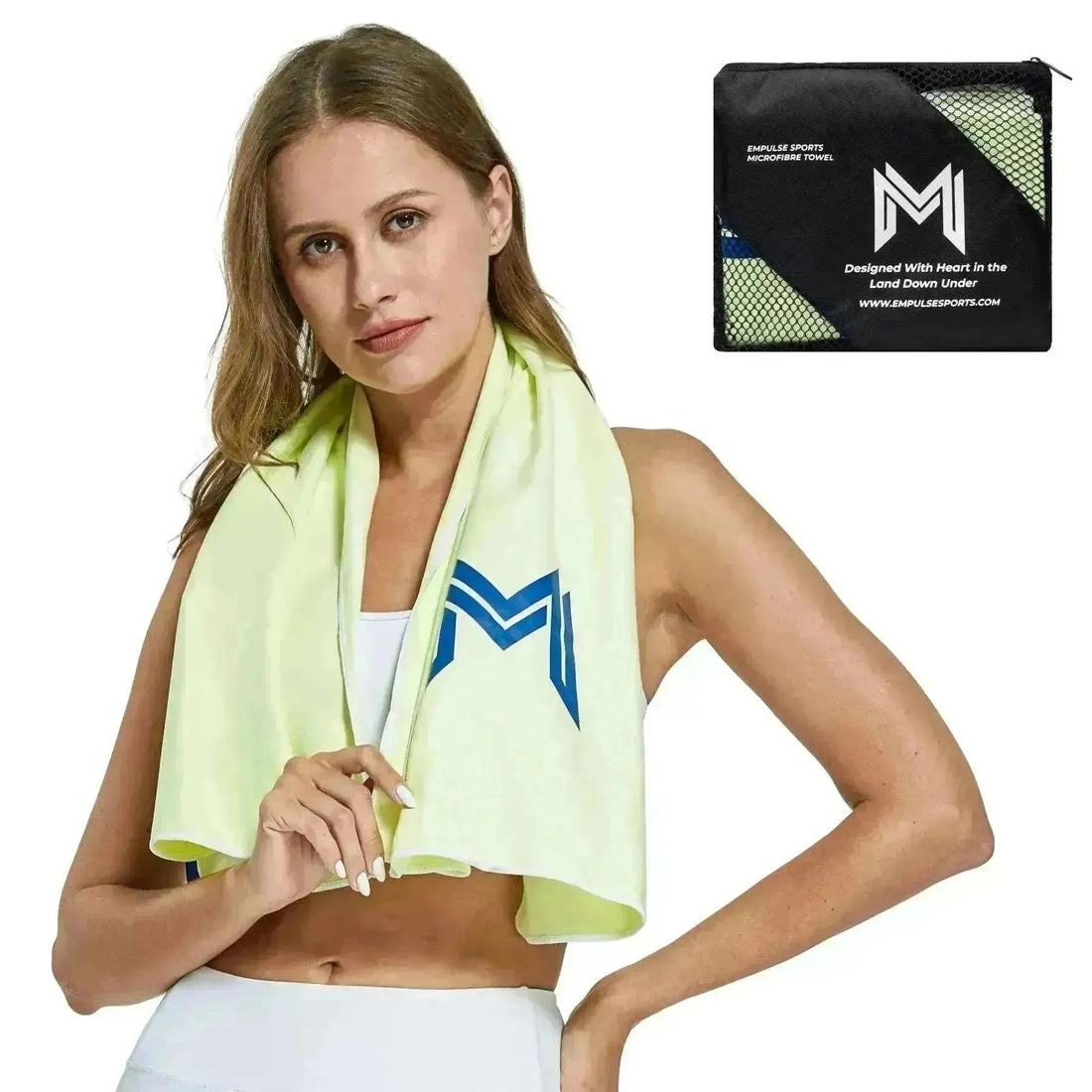 Studio pose of model wearing Empulse™ Lemon Zest towel with large navy logo in focus