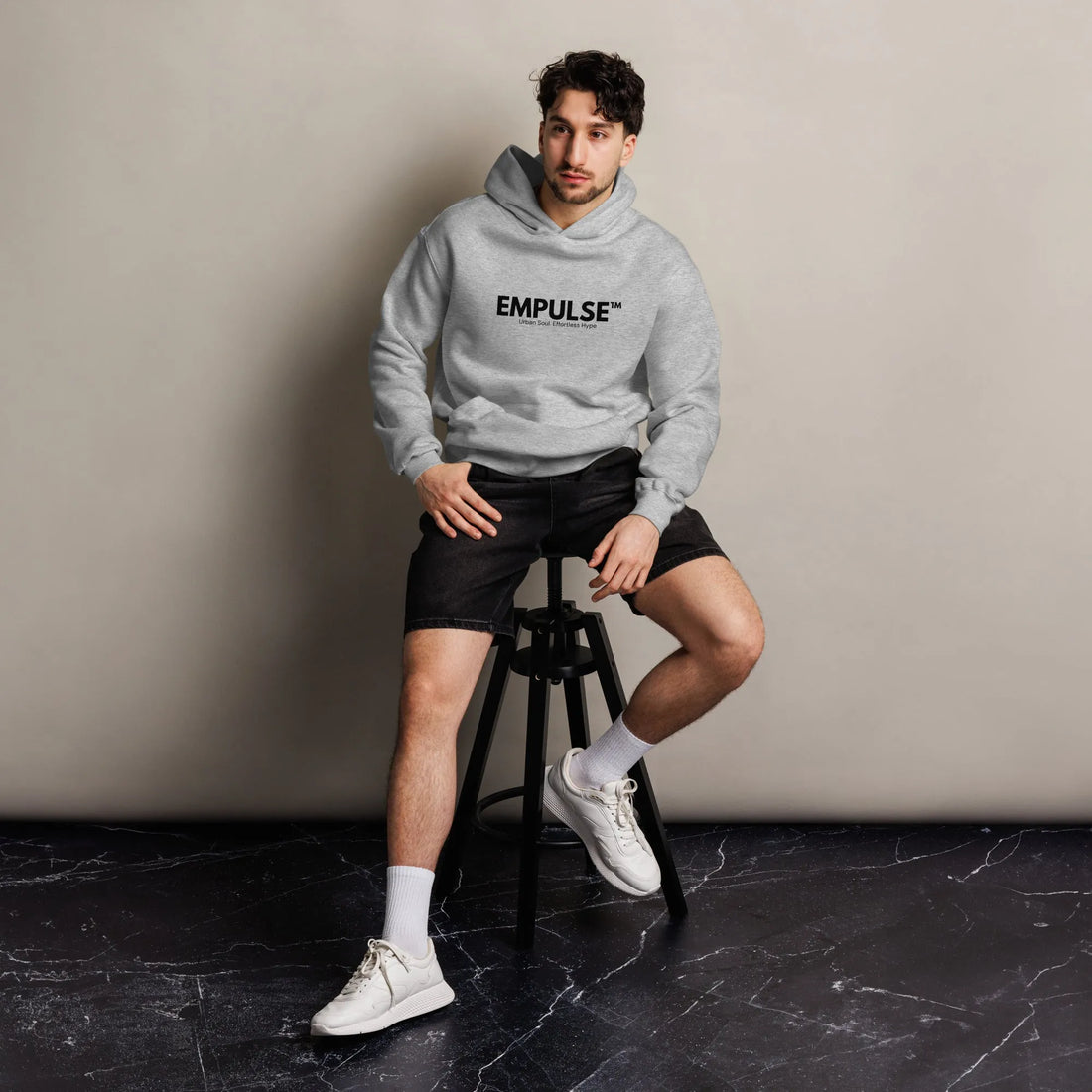 Rear flatlay of ash grey Empulse™ hoodie, highlighting simple, clean design