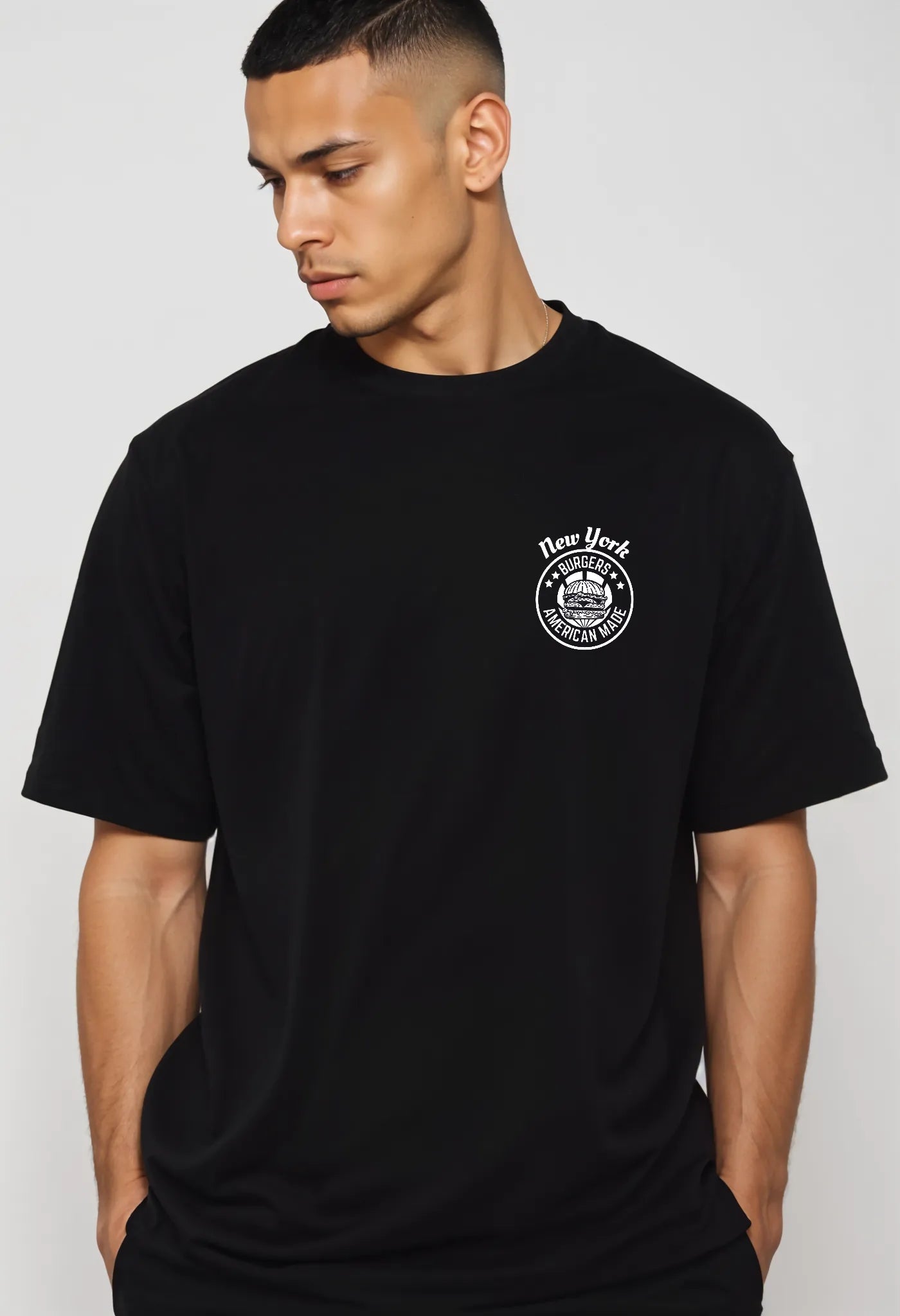 Side view of Empulse™ New York Sorona t-shirt in black with chest burger logo