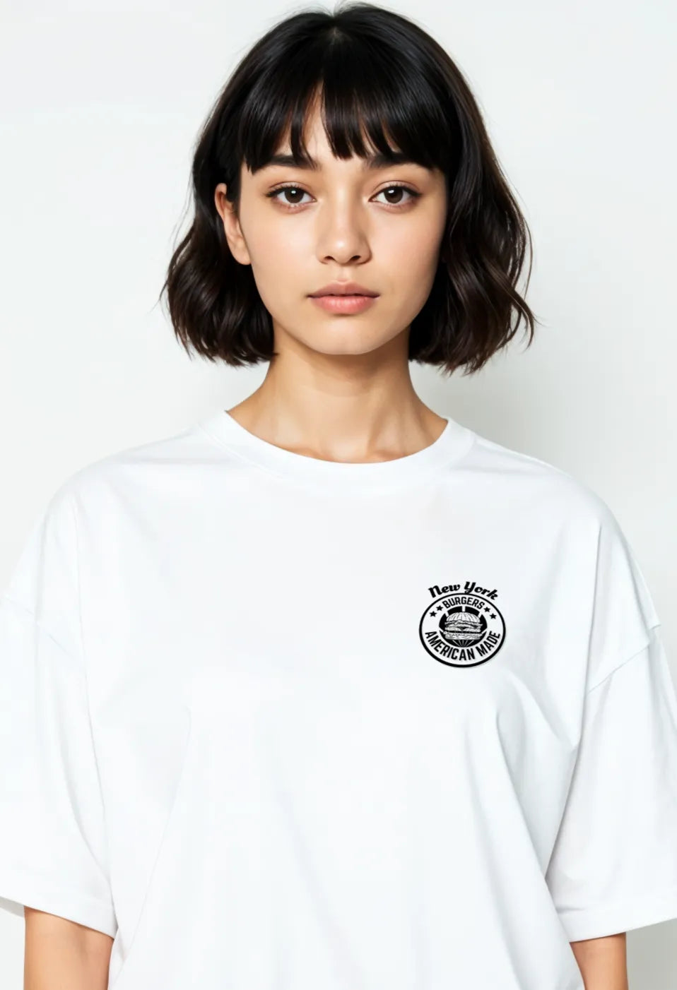 Front-facing view of Empulse™ Sorona New York burger tee with chest logo badge