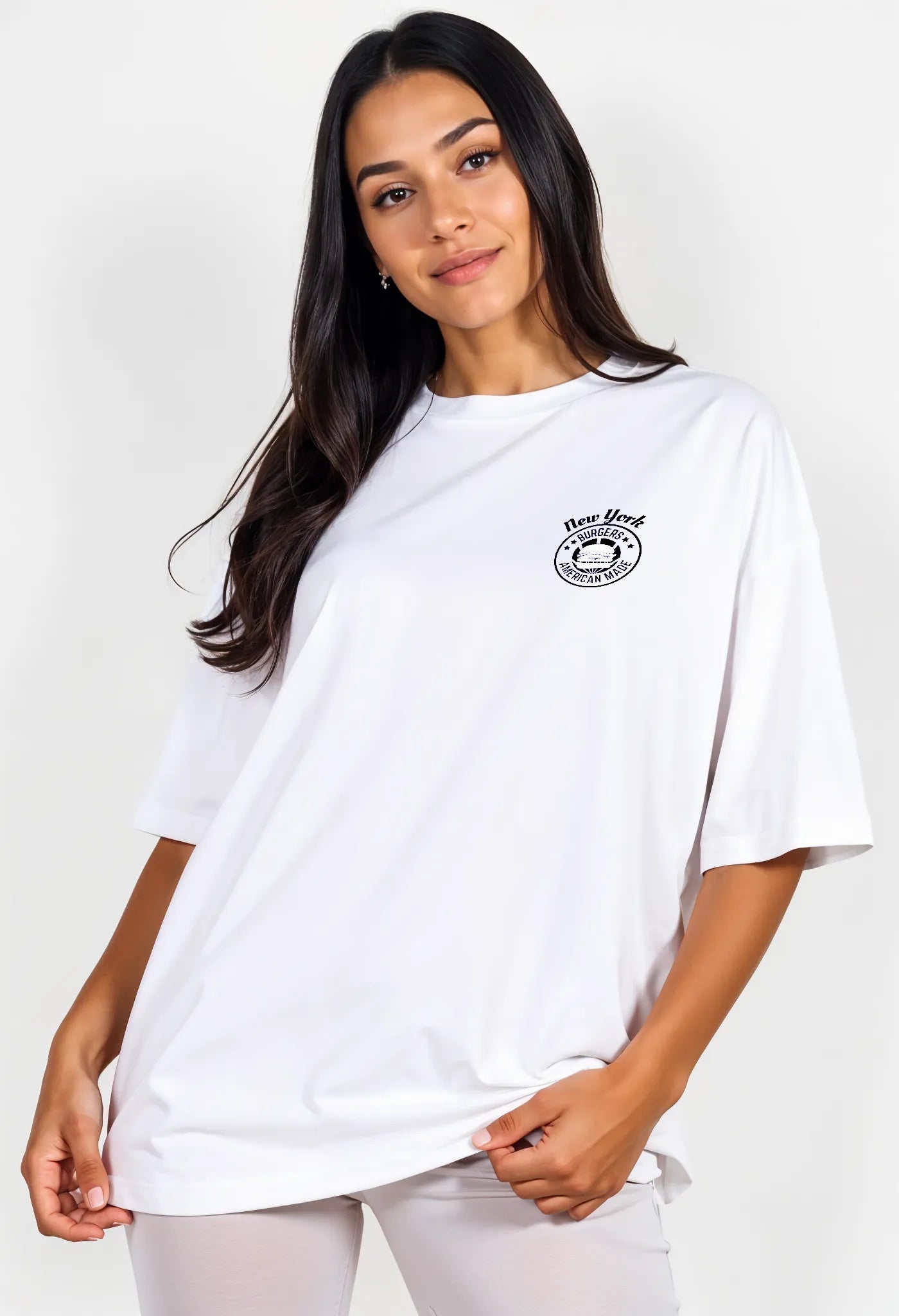 Empulse™ NYC Sorona burger tee in white with chest badge logo styled by female model