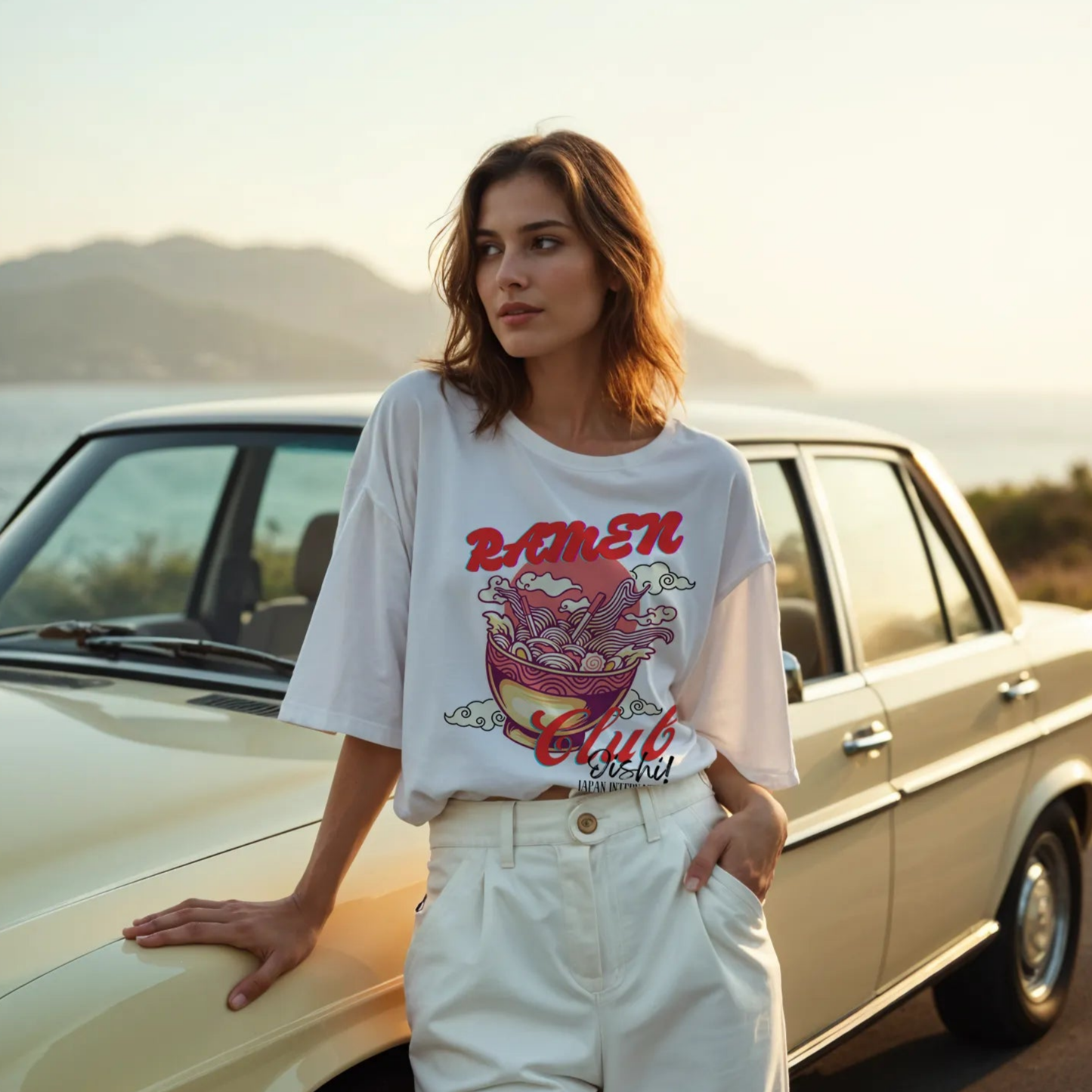 Empulse™ Oishii Ramen t-shirt made from Sorona cotton, styled in a nostalgic outdoor car scene, ocean background