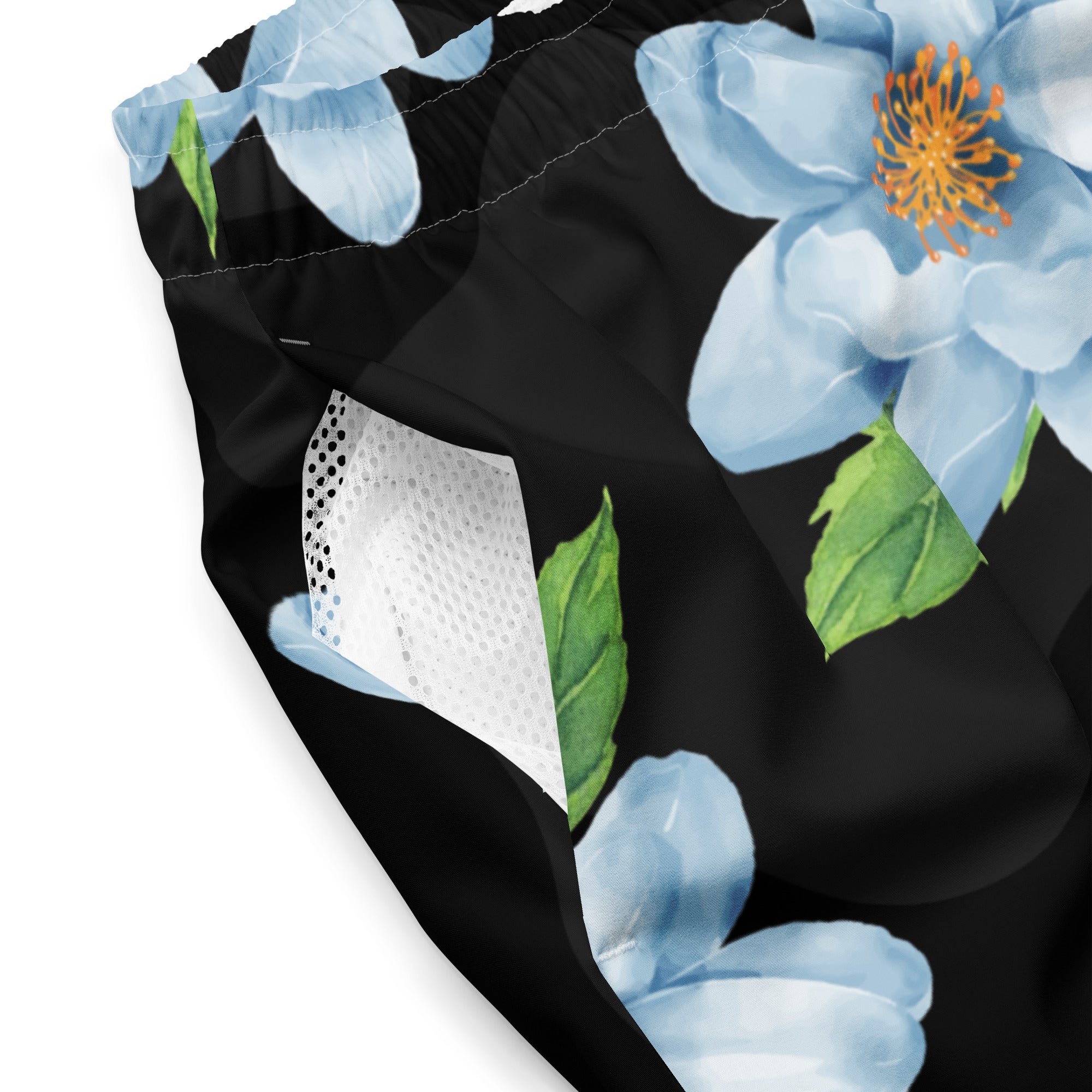 Close-up of Empulse™ Orchids swim shorts showing bold orchid flower print and mesh pocket
