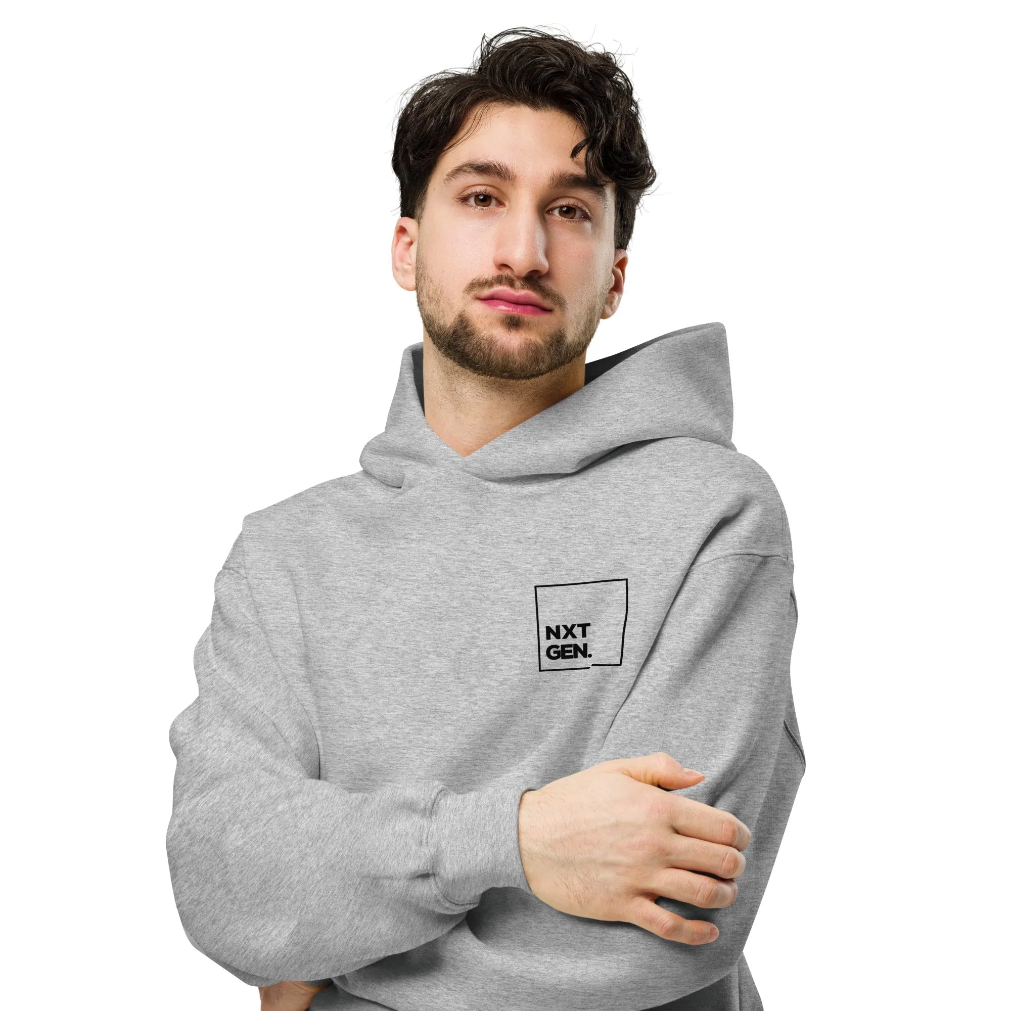Empulse™ oversized grey hoodie worn by male model in side-angled sitting pose