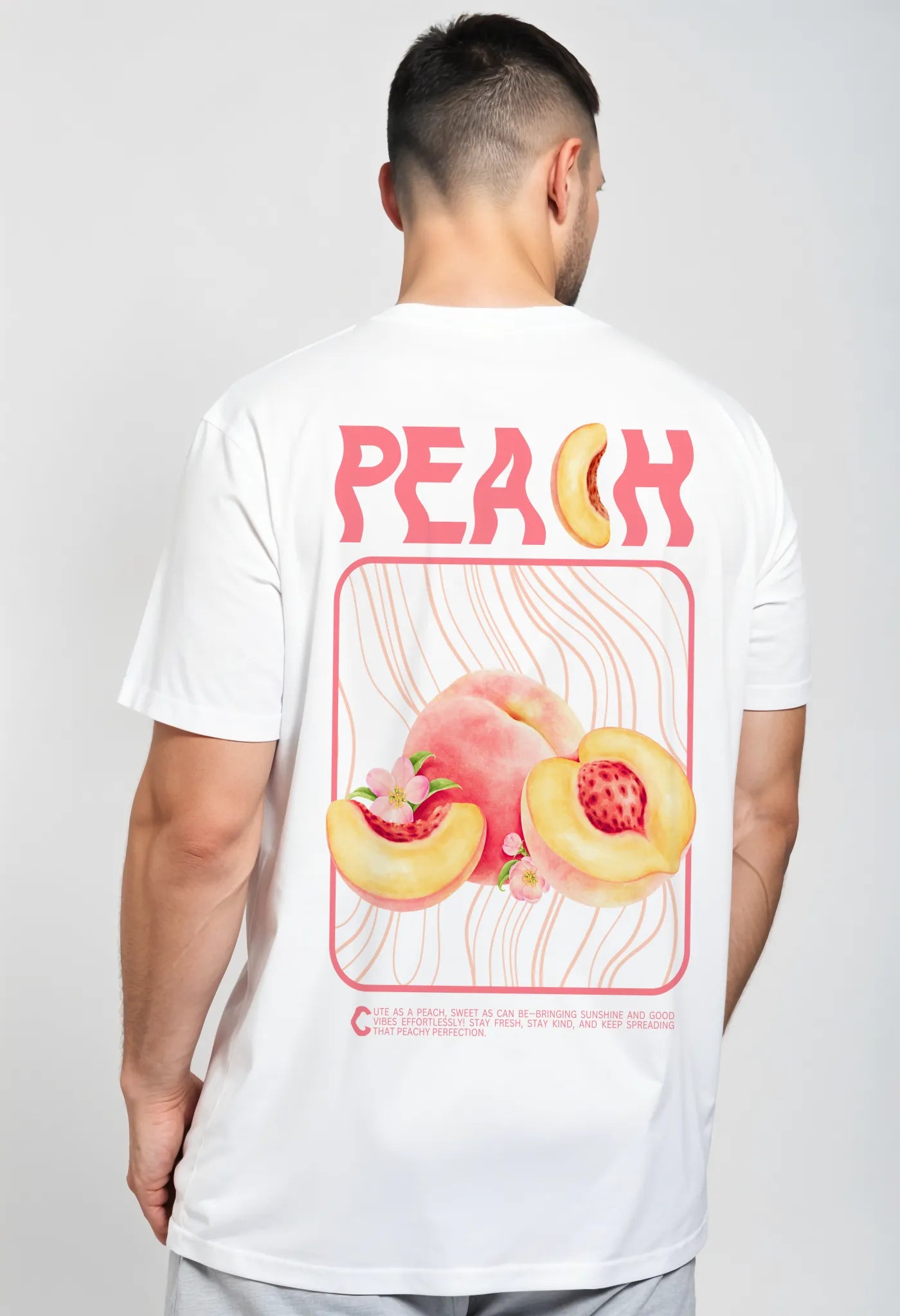 Back view of Empulse™ white Sorona t-shirt featuring large peach illustration and club-style typography