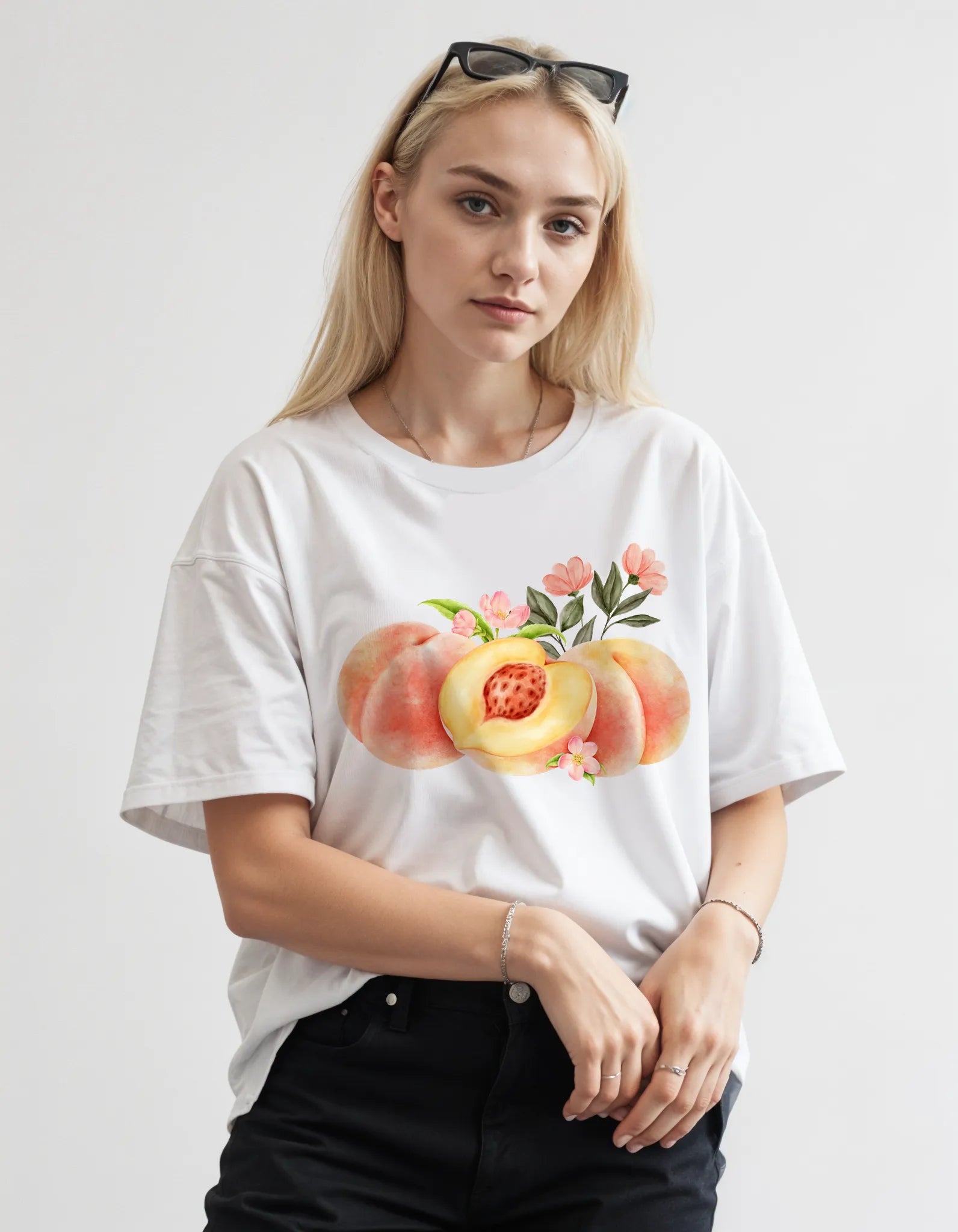 Empulse™ white Peach Sorona t-shirt styled with large peach fruit graphic, worn by female model
