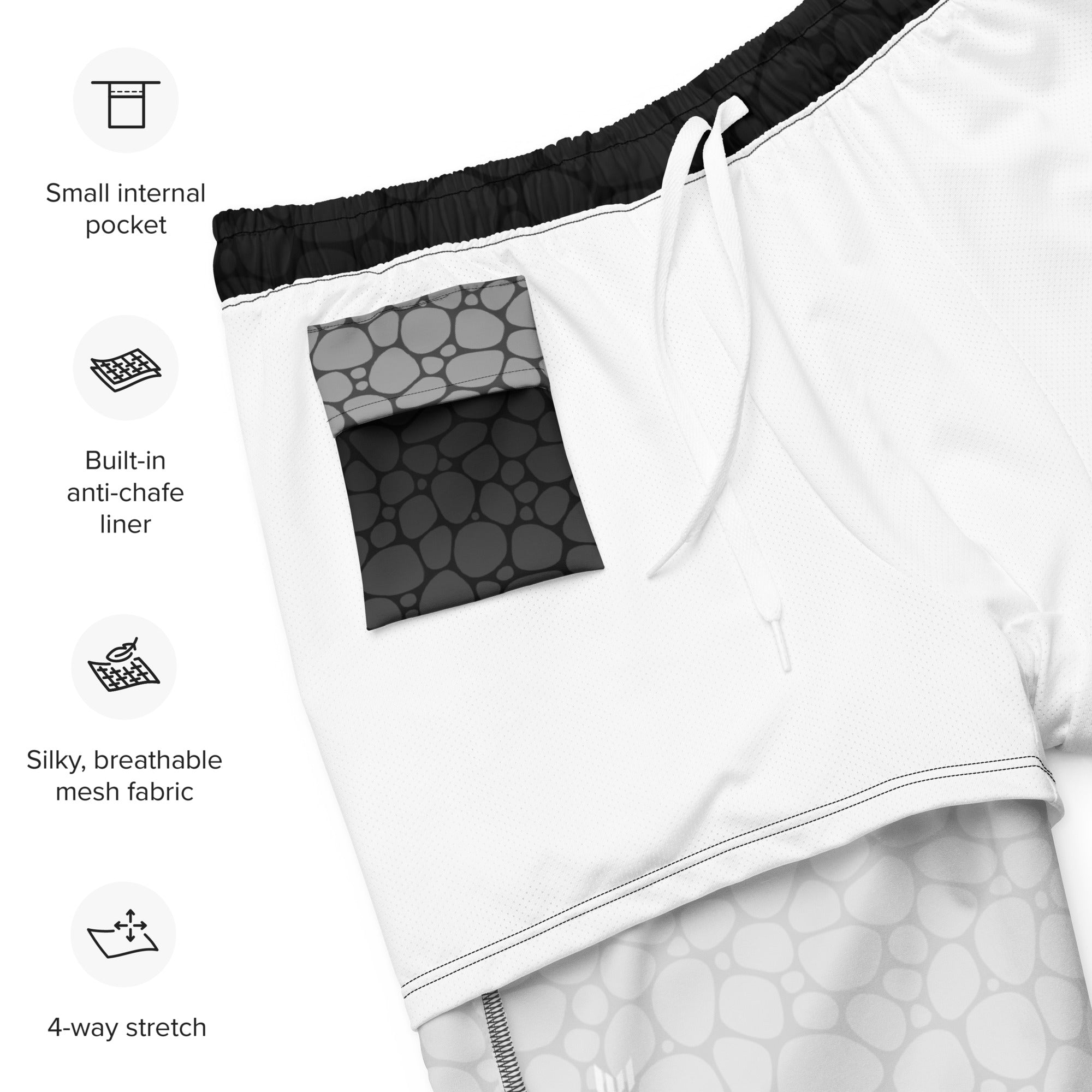 Flat lay of Empulse™ Pebbles swim shorts showing inside waistband label and sizing info