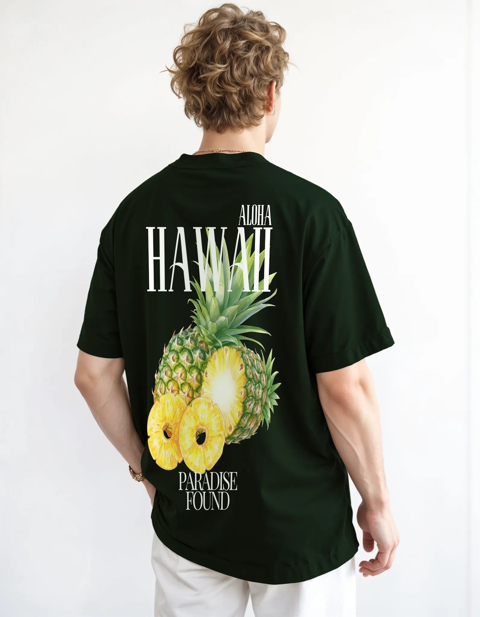 Empulse™ Pineapple Hawaii t-shirt in forest green Sorona blend with large tropical backprint, worn by male model
