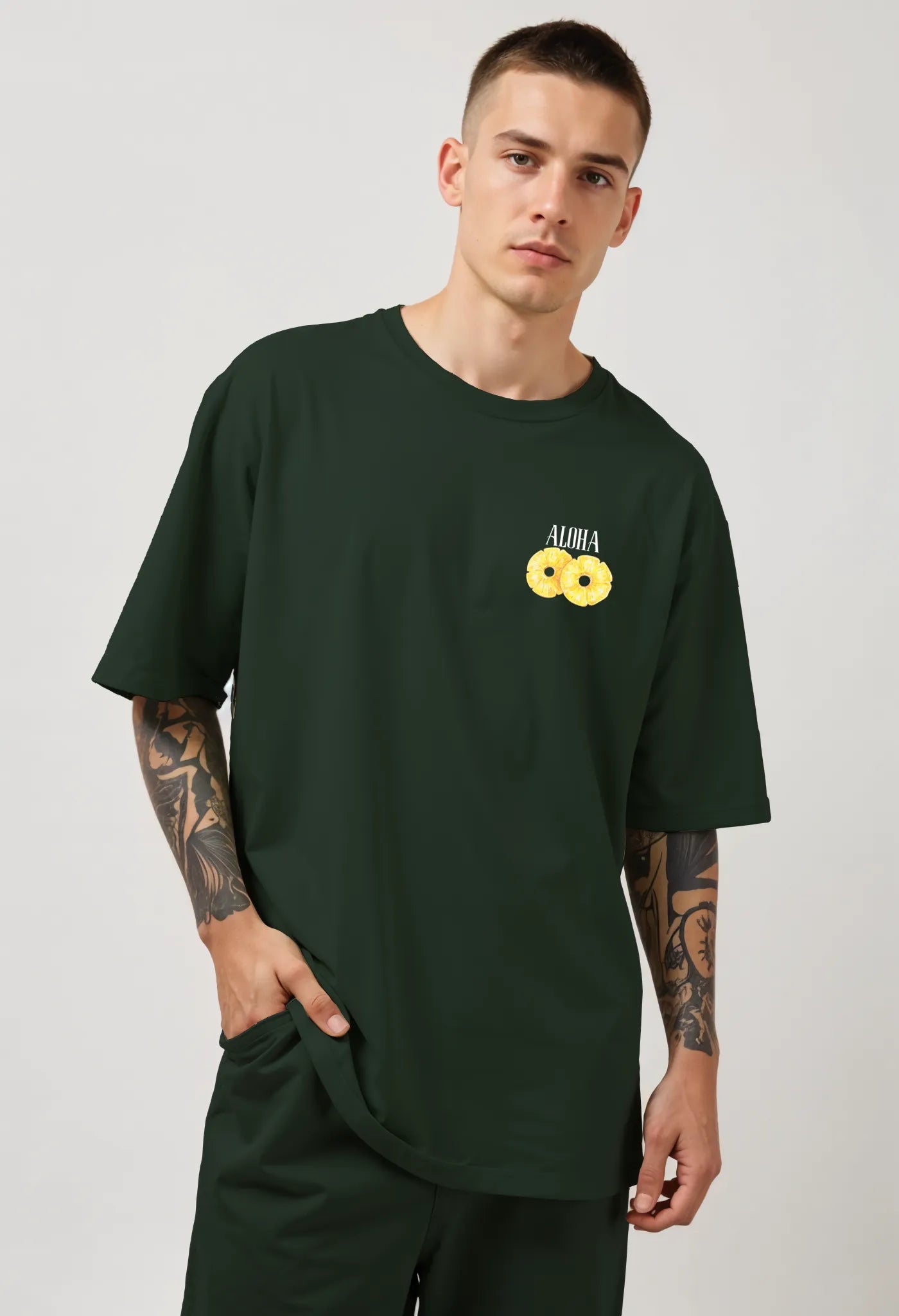 Empulse™ forest green pineapple t-shirt made from Sorona, styled in drop-shoulder streetwear fit