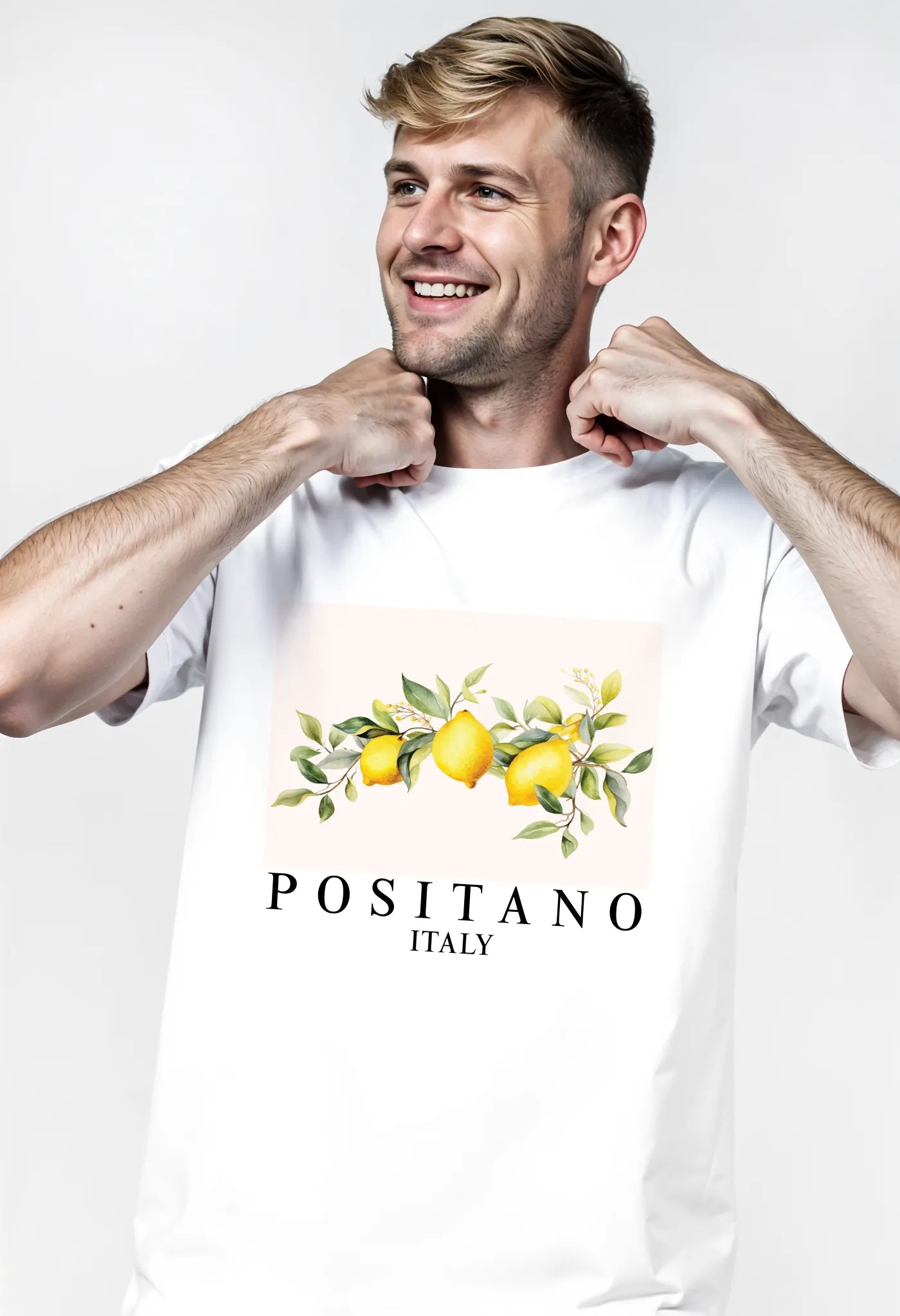 Empulse™ white Sorona t-shirt with lemon graphic worn by male model adjusting neckline