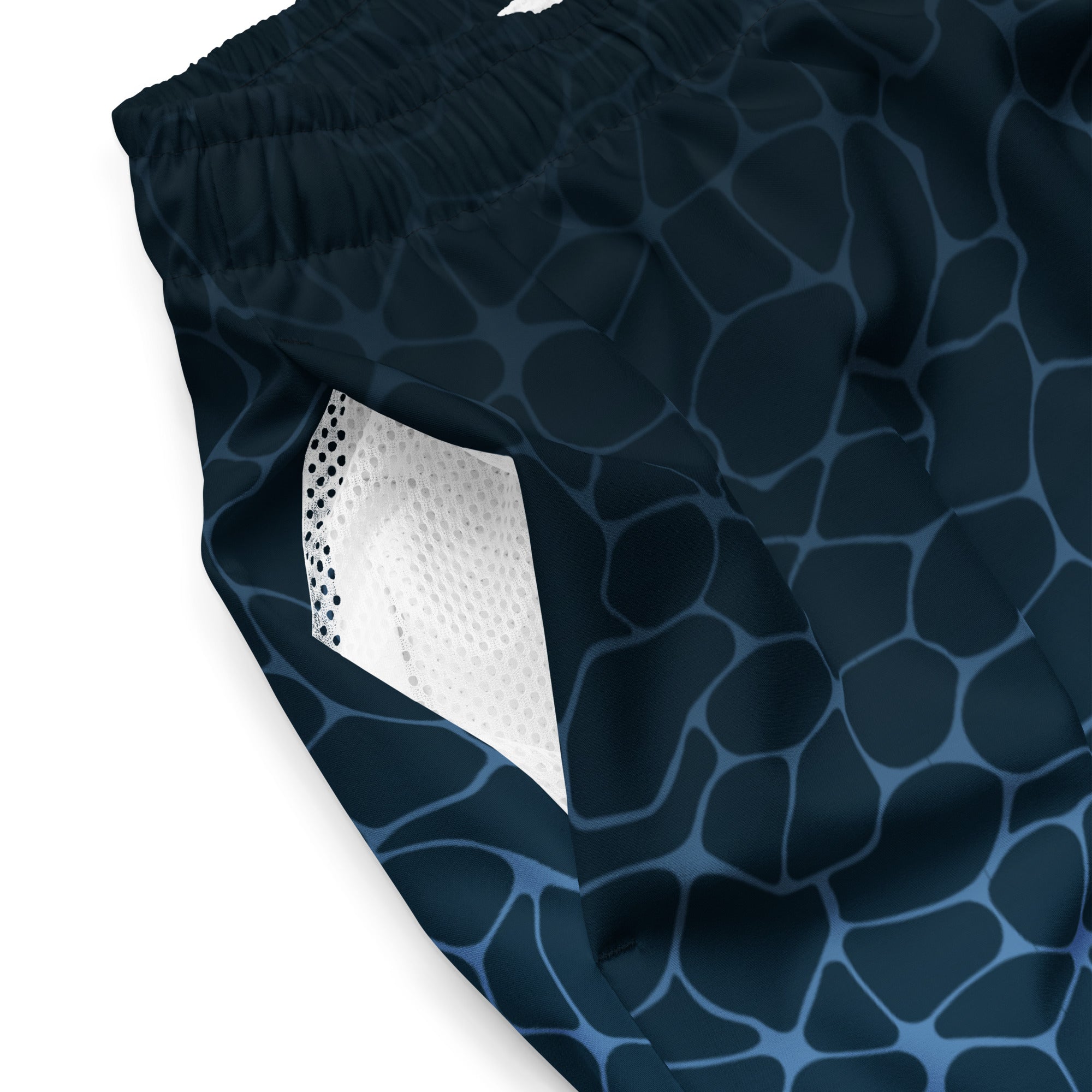Close-up of Empulse™ Ripple Magic swim shorts showing mesh interior and ripple pattern