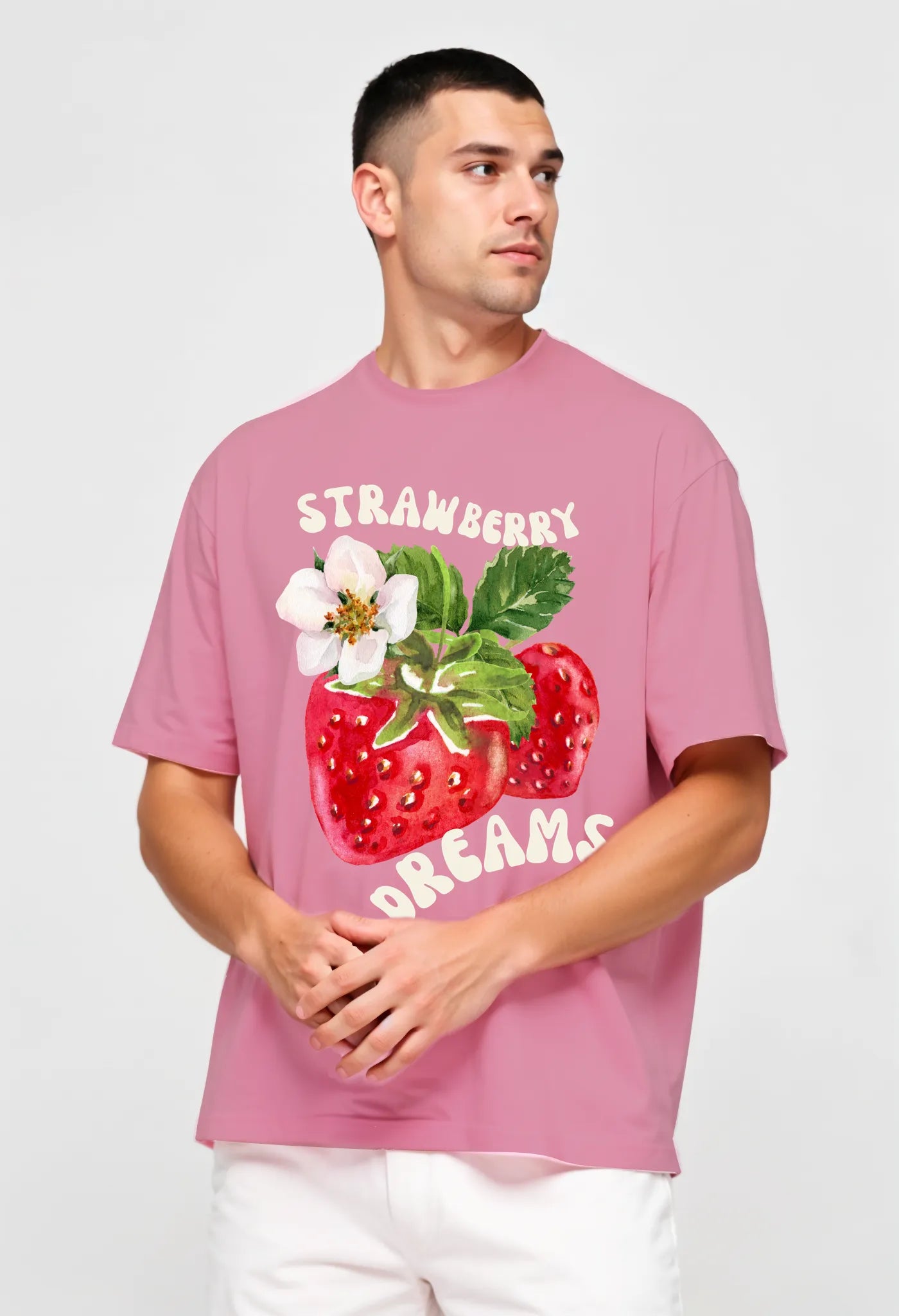 Empulse™ light pink Sorona tee with strawberry print styled by male model looking left