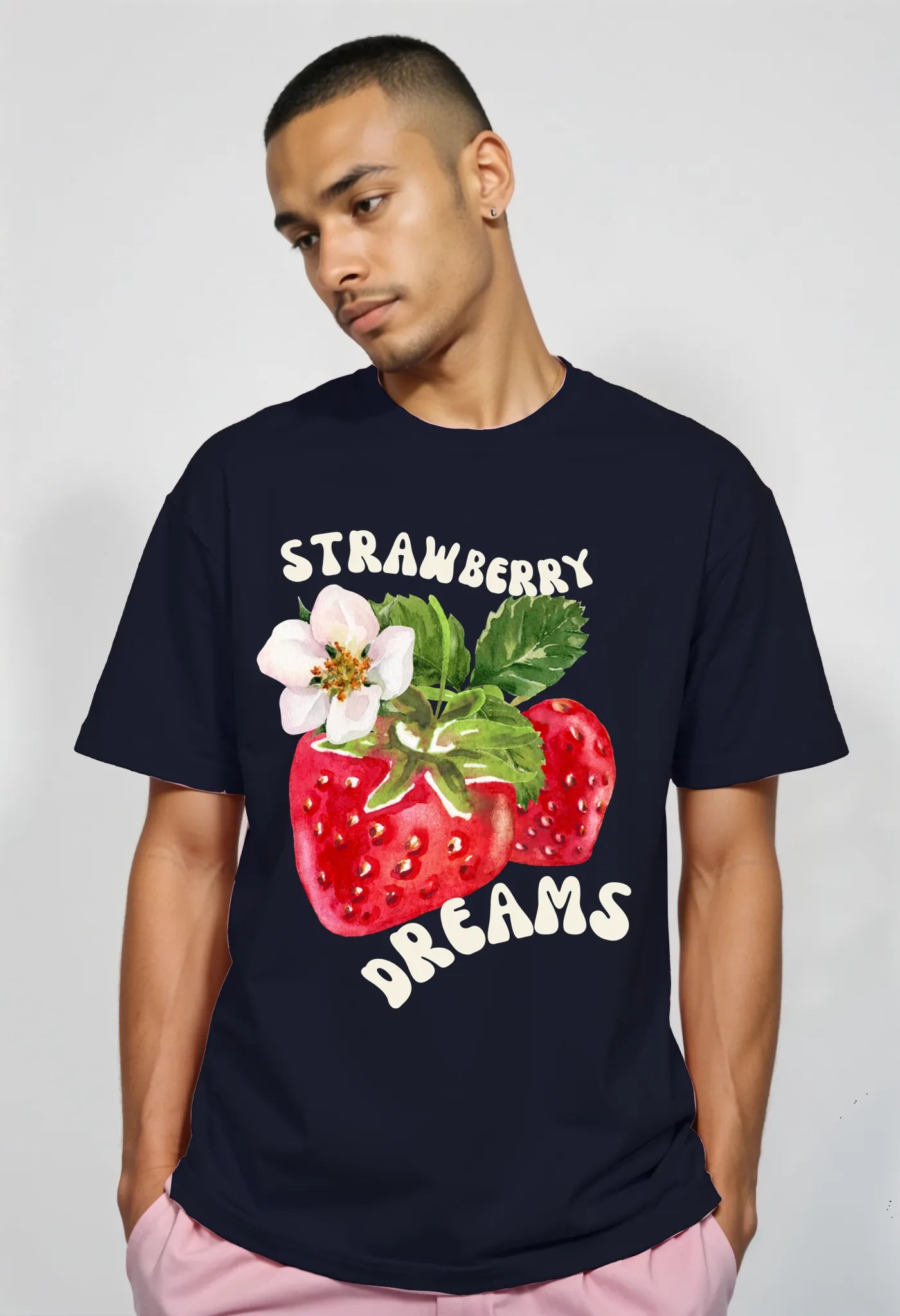 Empulse™ Sorona tee in navy with drop-shoulder and strawberry graphic, viewed from side