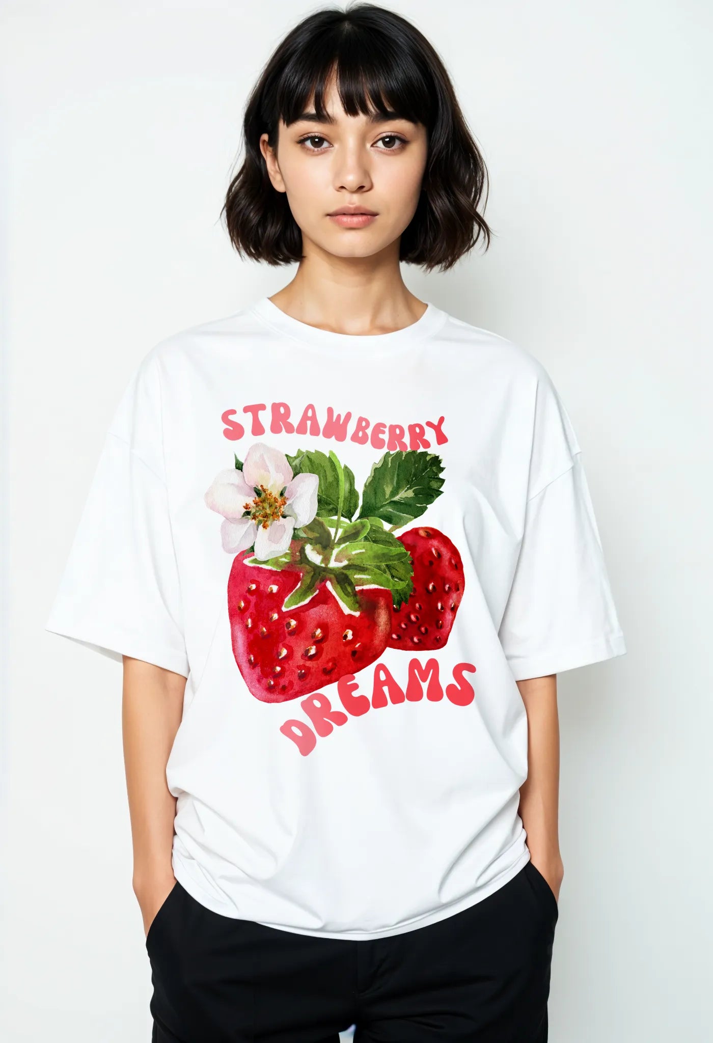 Empulse™ Strawberry Dreams t-shirt in white Sorona blend with bold fruit print, worn by female model front-facing