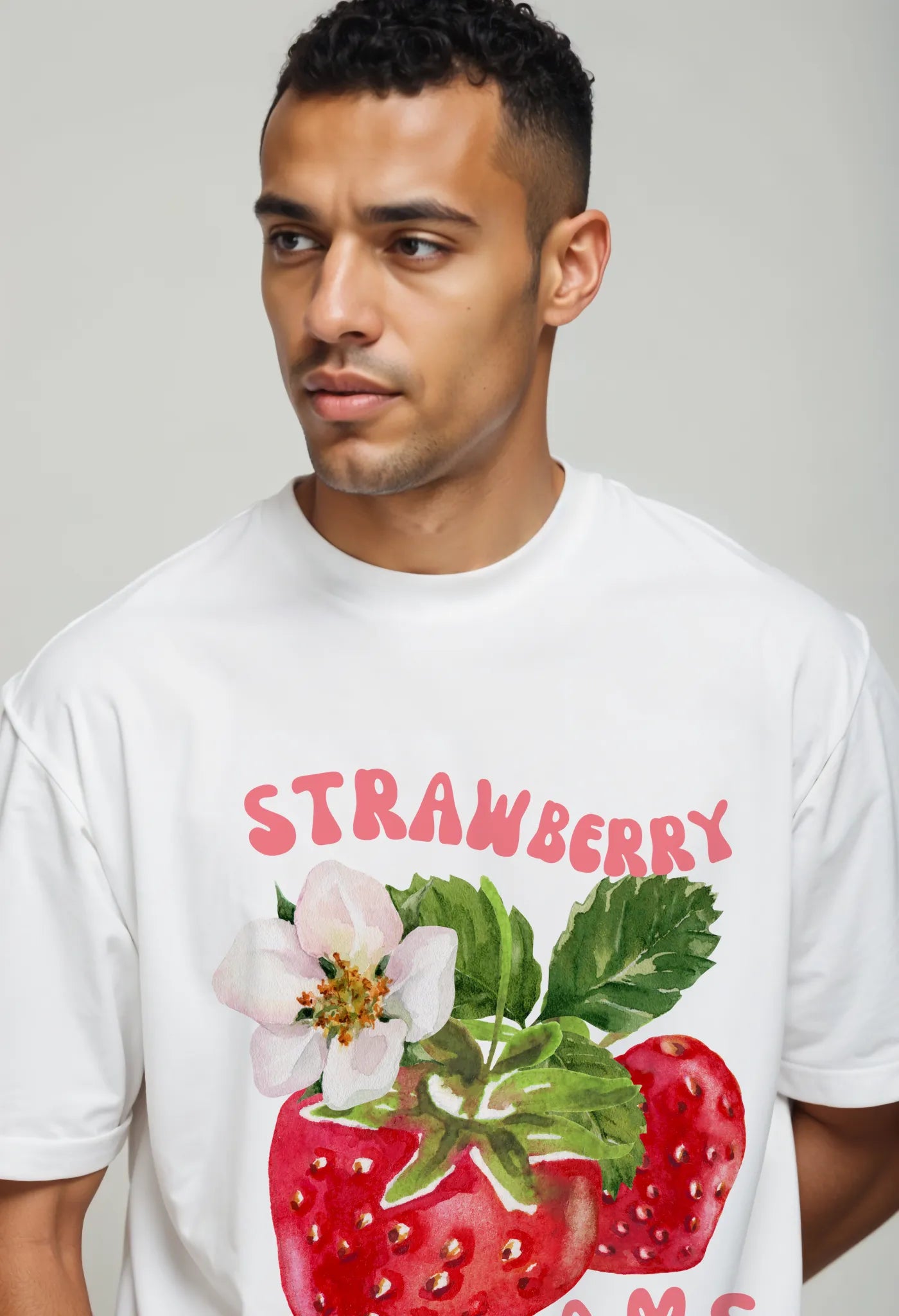 Close-up of Empulse™ Sorona tee showing vivid red strawberry artwork and bold "Strawberry Dreams" text
