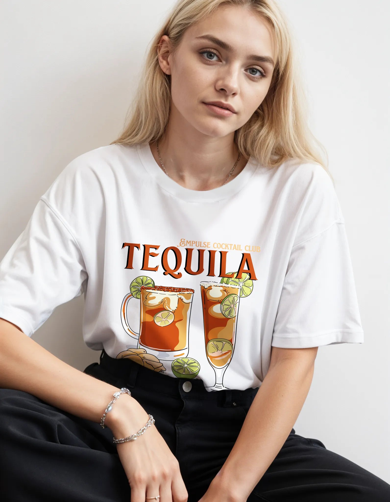 Empulse™ Sorona white tee featuring vibrant tequila cocktail print, styled in relaxed studio setup