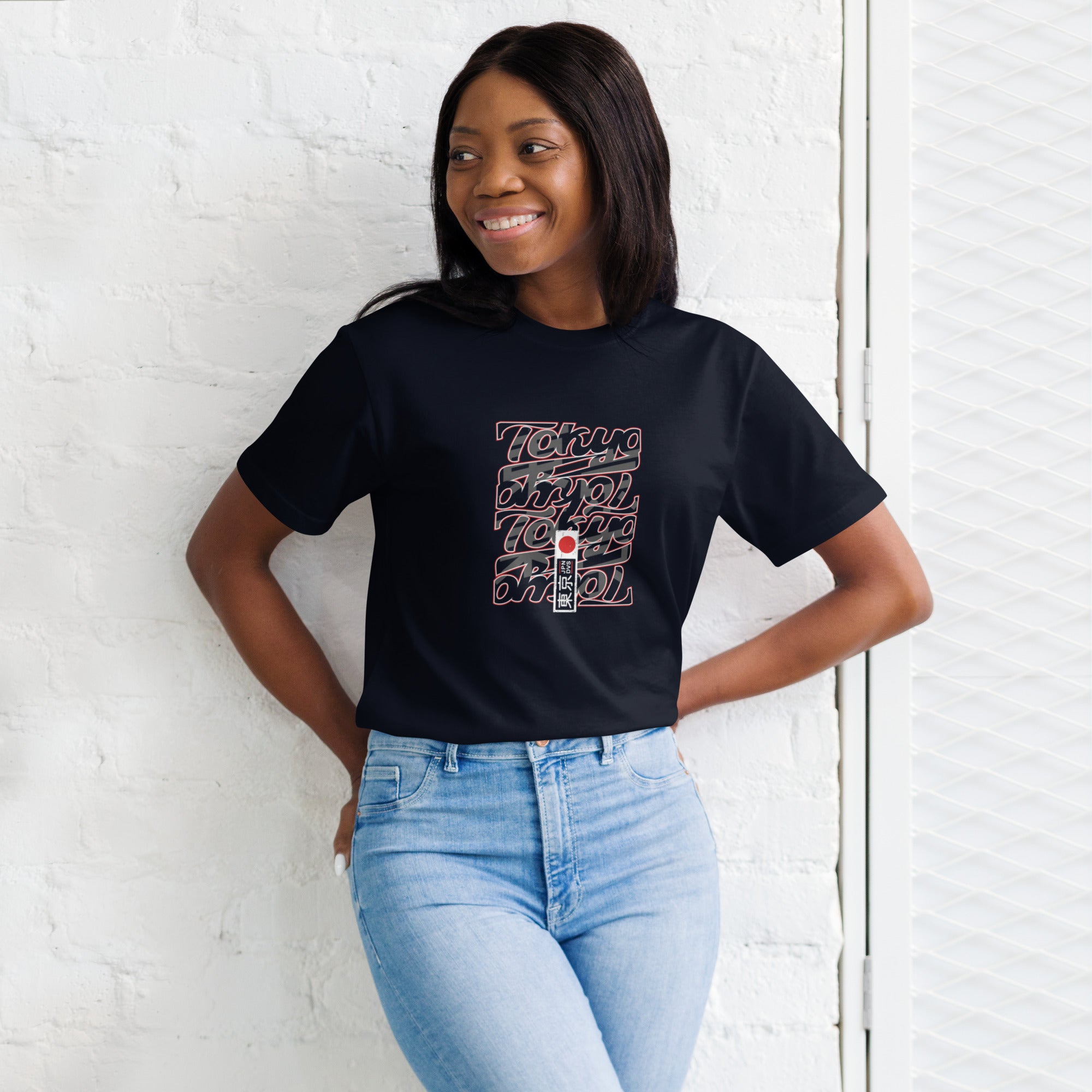 Confident female pose in Empulse® Tokyo Stacks Tee with bold graphic