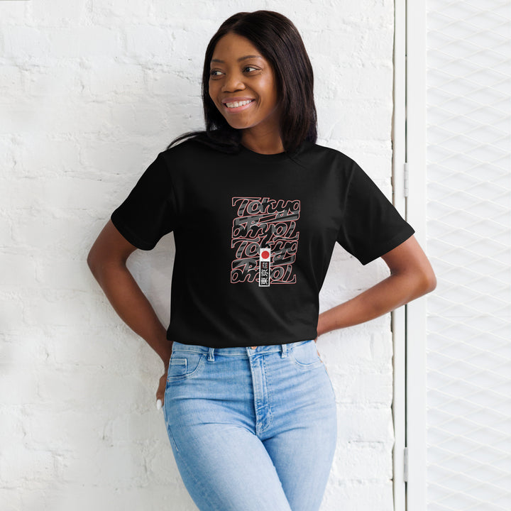 Female model smiling in Empulse® Tokyo Stacks Tee with layered Tokyo text design