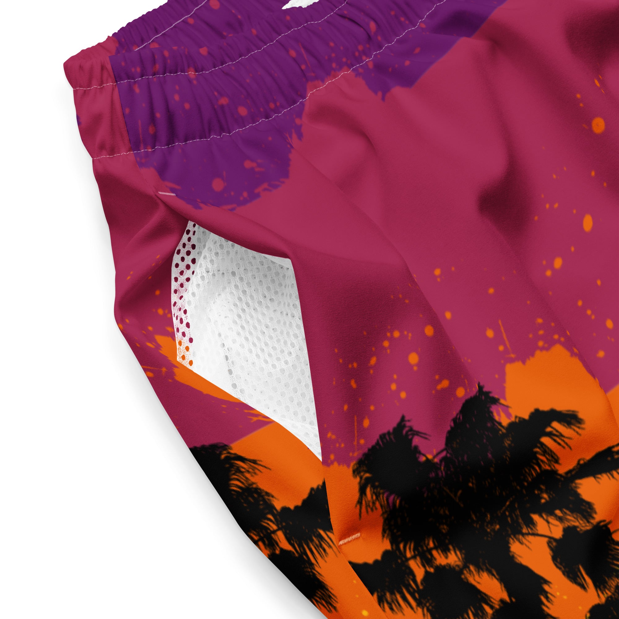 Close-up of Empulse™ Tropical shorts showing palm tree print and white mesh inner lining