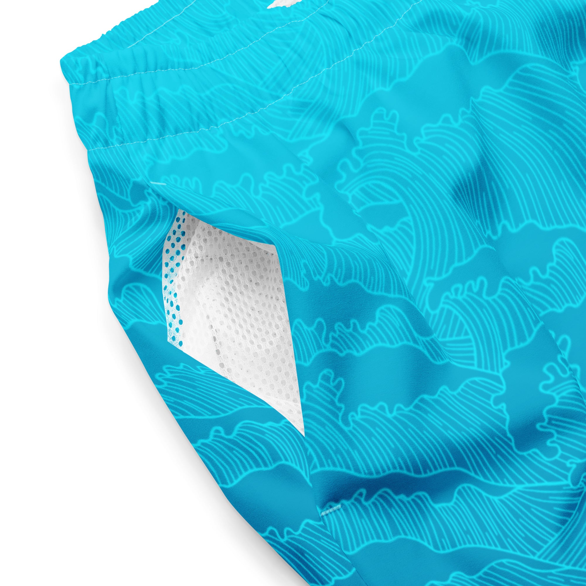 Close-up of Empulse™ Turquoise Tides fabric showing vivid color and white mesh interior