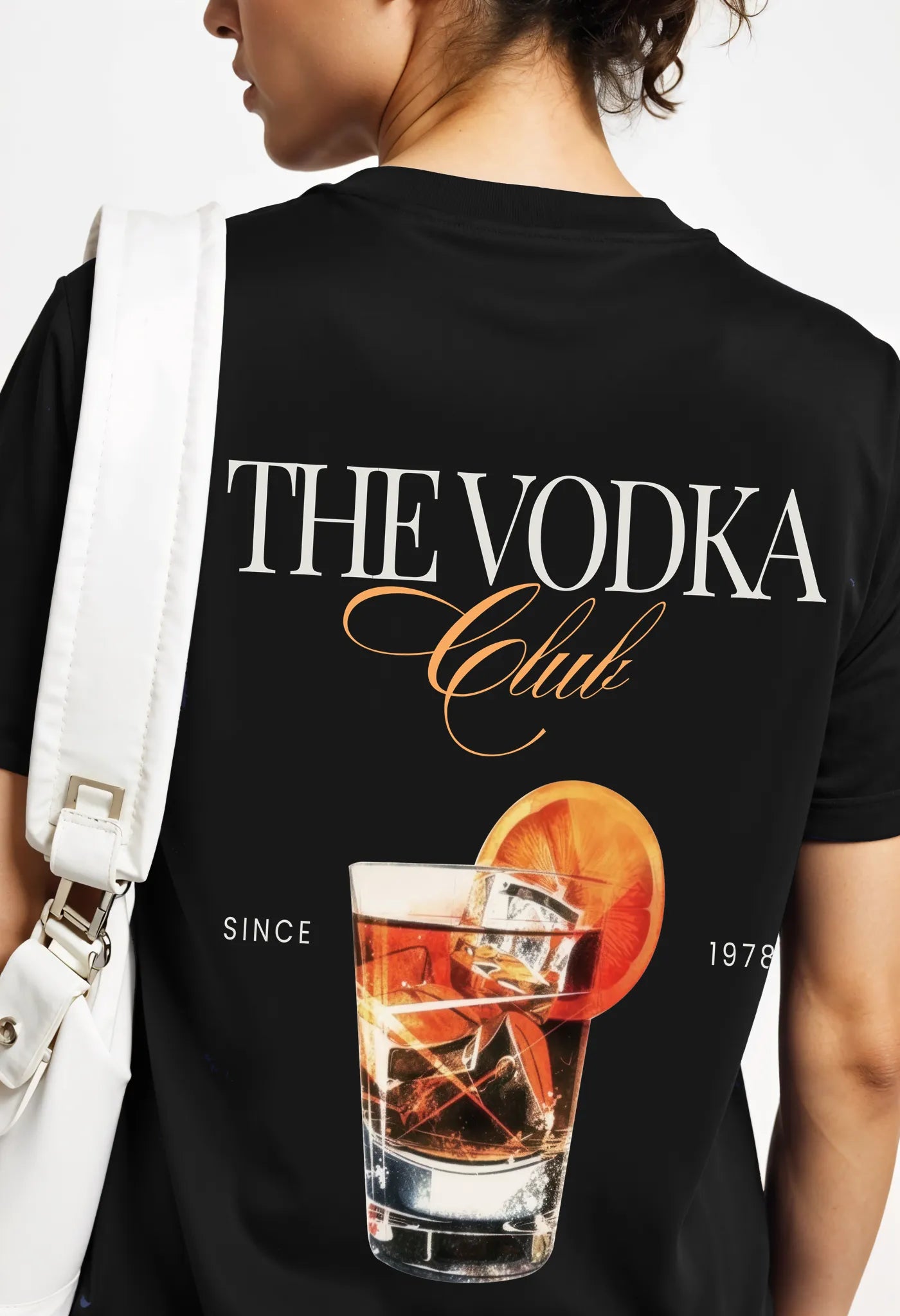 Empulse™ black Sorona Vodka Club tee worn by model showing front minimalist logo and relaxed fit