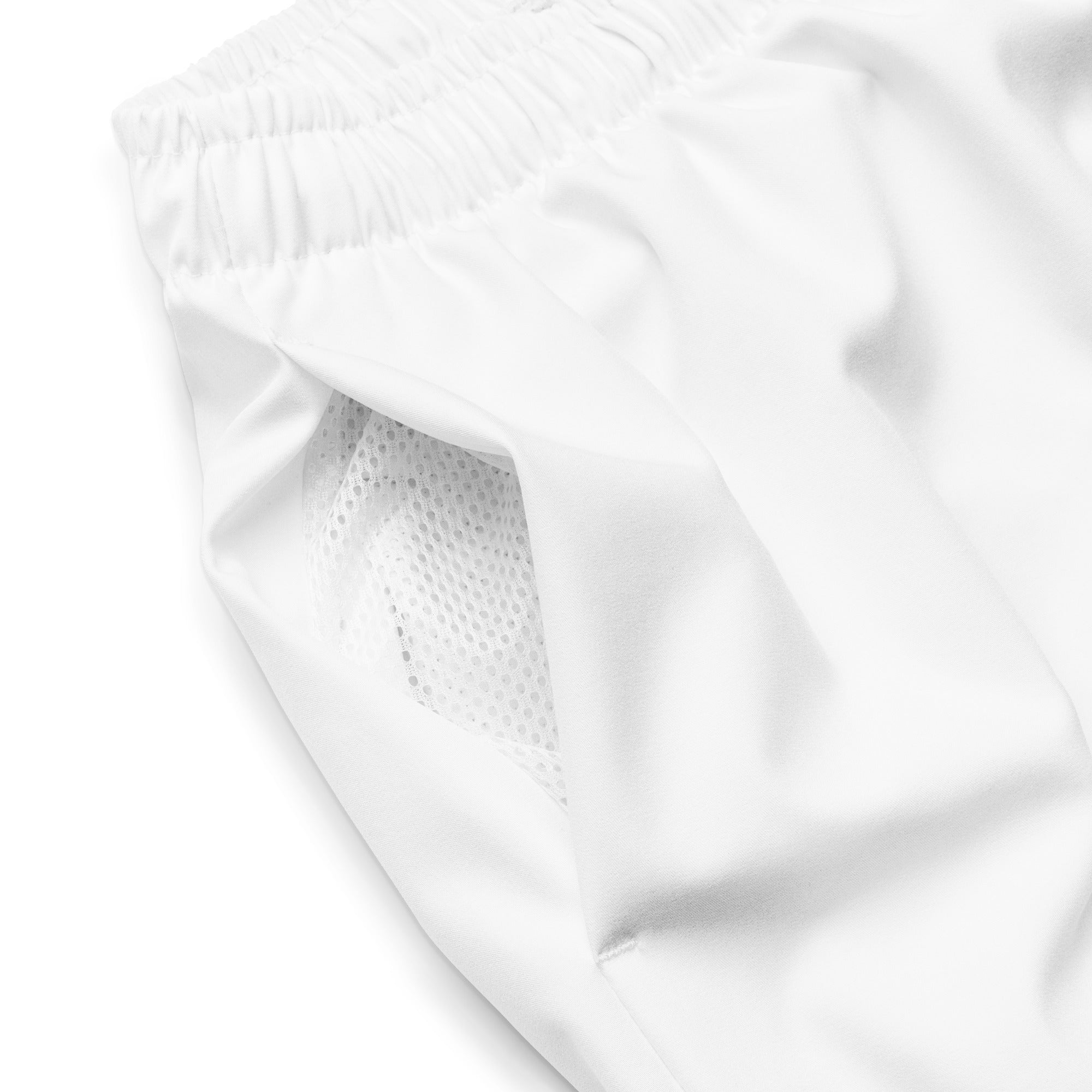 Close-up of Empulse™ White shorts showing pocket seam and soft fabric texture