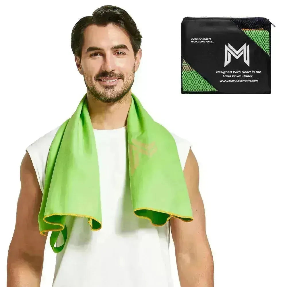 Studio photo of model with Empulse™ Zen Lift towel featuring bold M logo and green tones