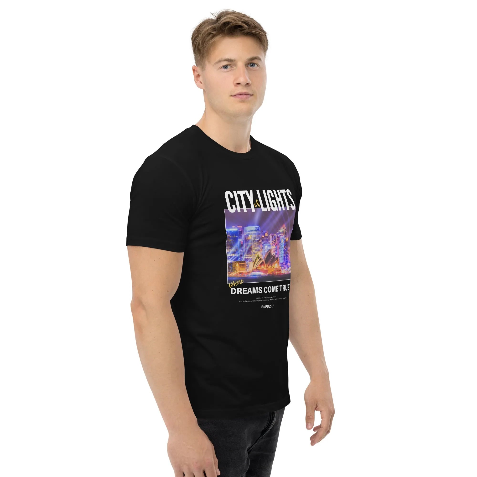 Male model wearing Empulse™ black City Lights tshirt with vibrant Sydney skyline print and bold graphic text on chest

