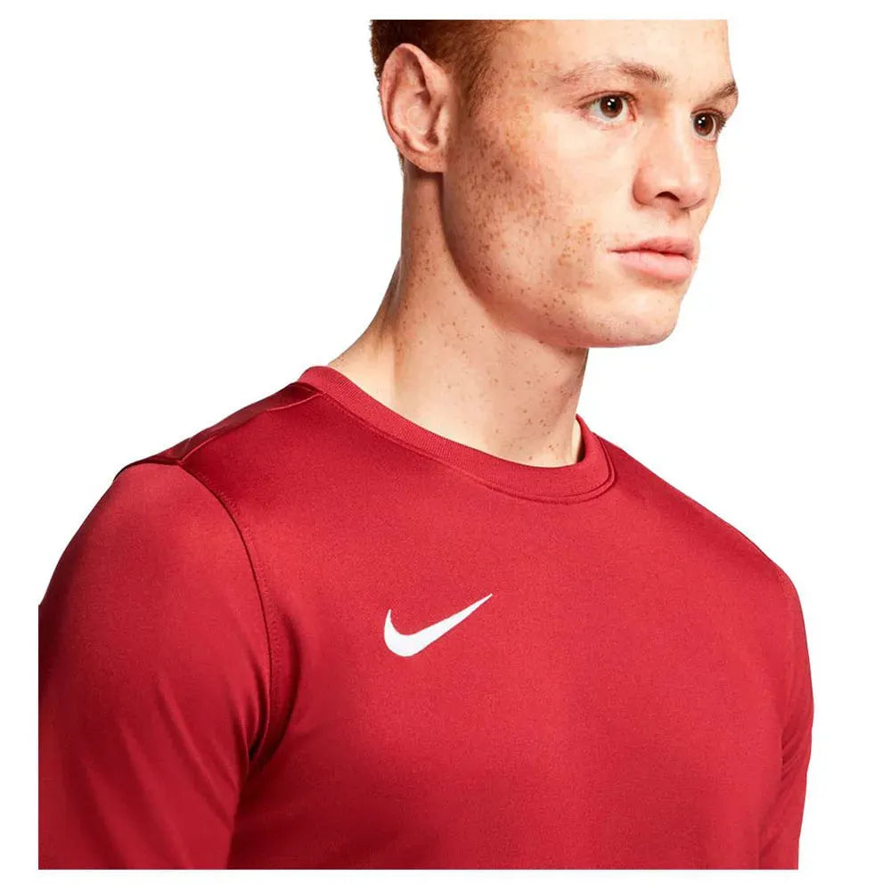 Close-up of Nike Men's Park 7 Jersey in red showing white swoosh logo near shoulder