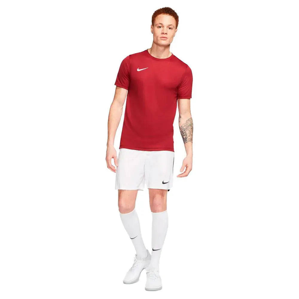 Full front view of model wearing red Nike Park 7 Jersey with white shorts and socks